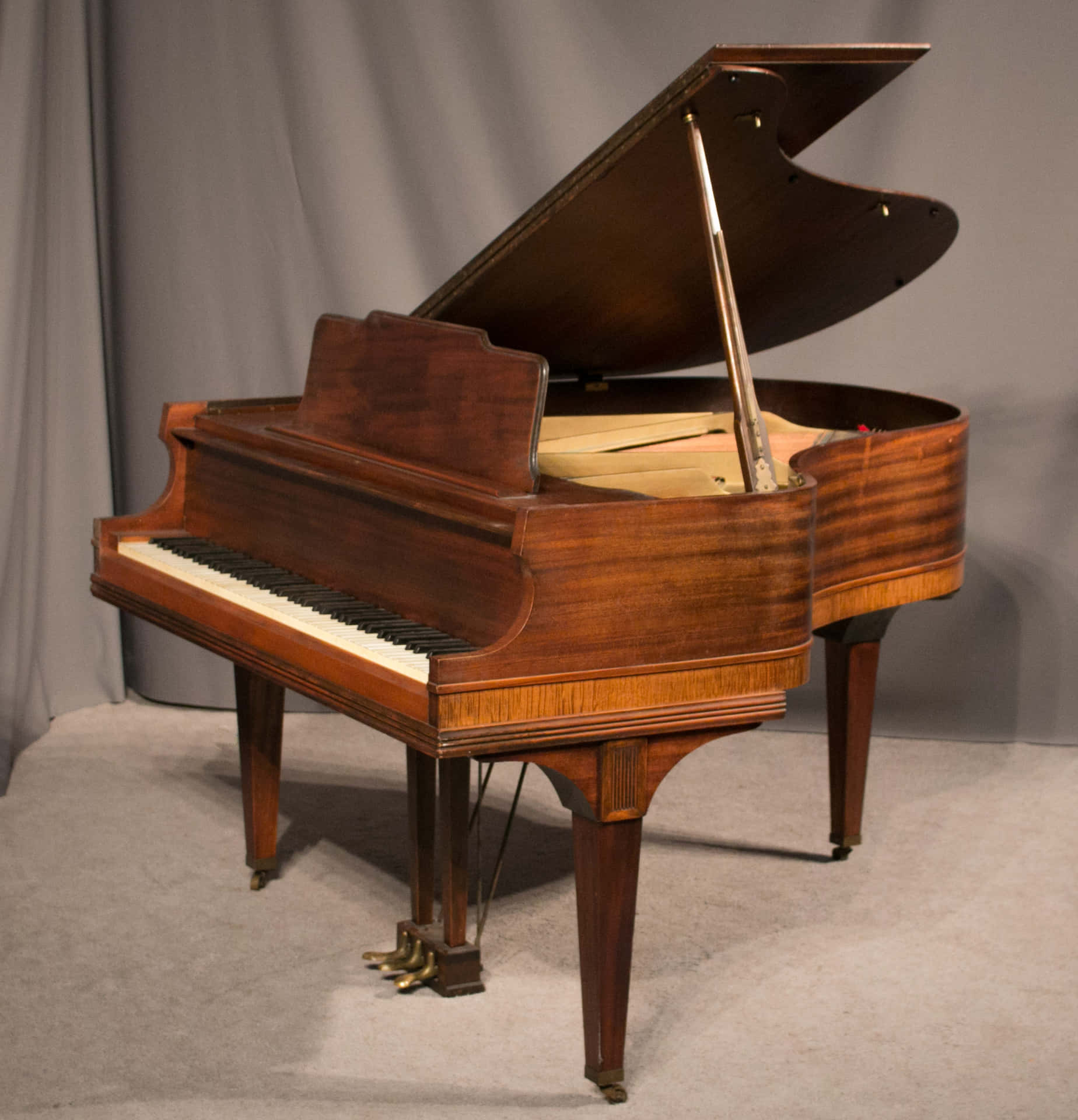 A beautiful acoustic piano surrounded by the warmth of natural wood