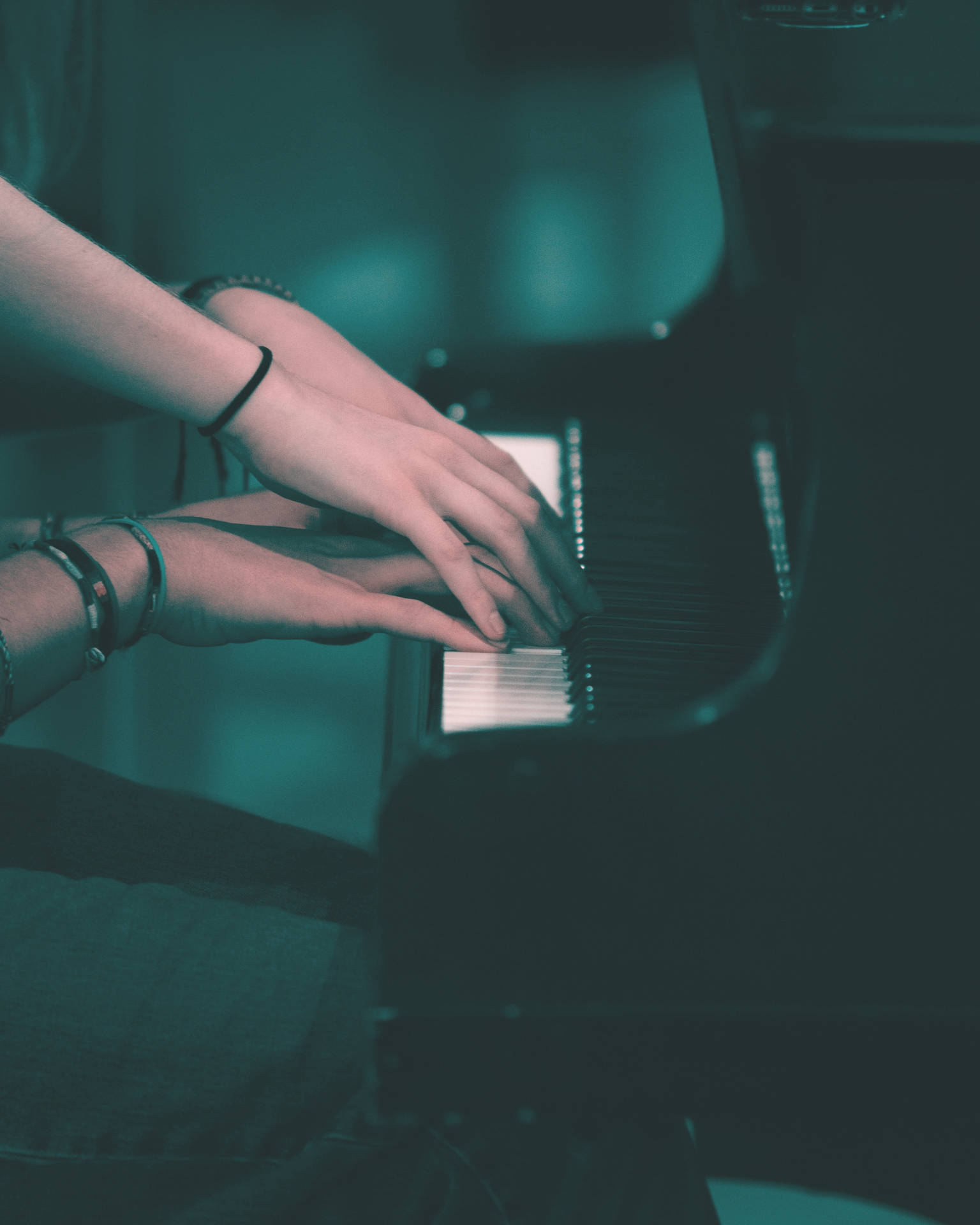 Piano With Hands Touching Wallpaper
