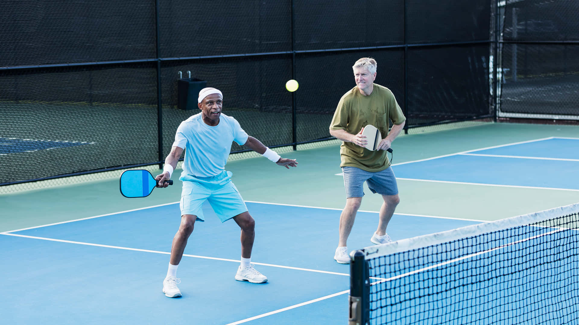 Play pickleball with friends and enjoy a fun court game