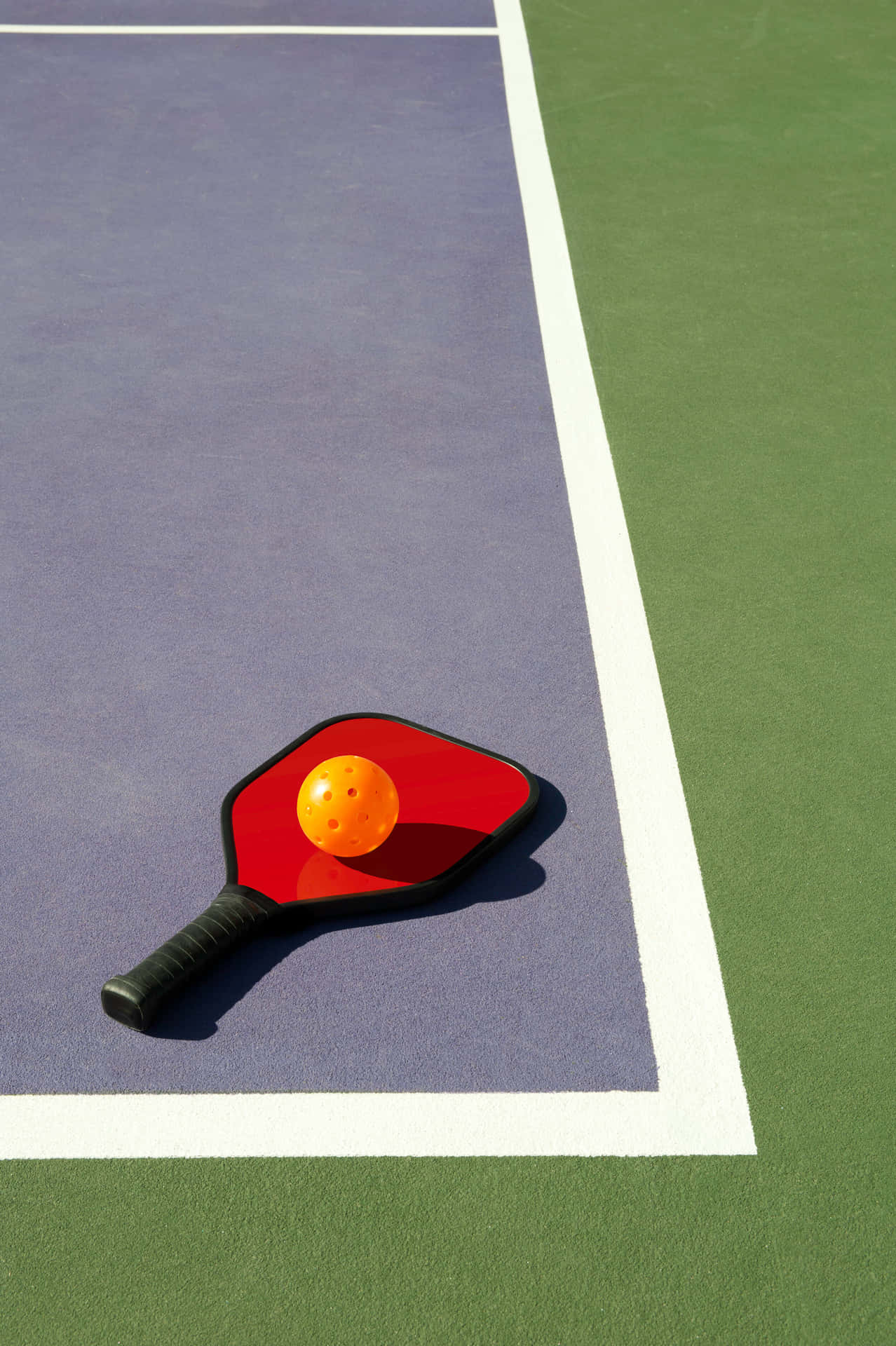 A Tennis Racket On A Tennis Court