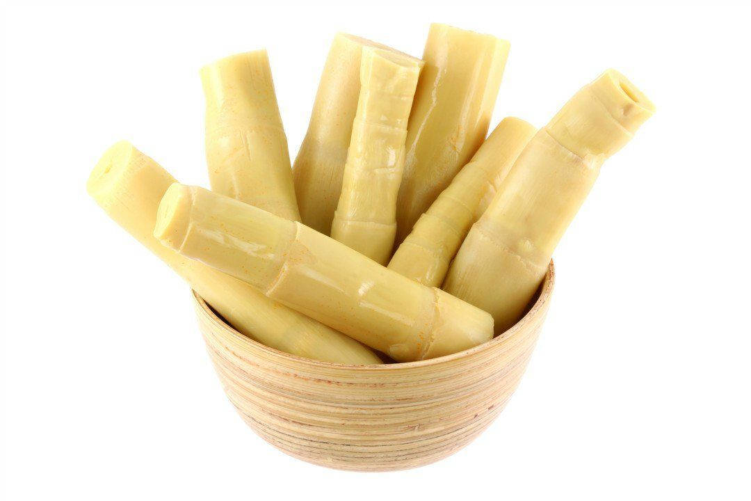 Fresh Bamboo Shoots in a Rustic Wooden Bowl Wallpaper
