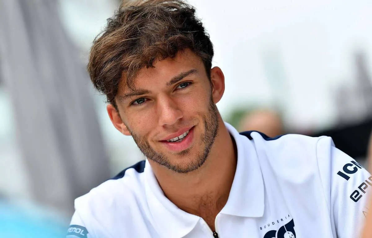 Pierre Gasly - F1 Ace in a cool white polo shirt Wallpaper
