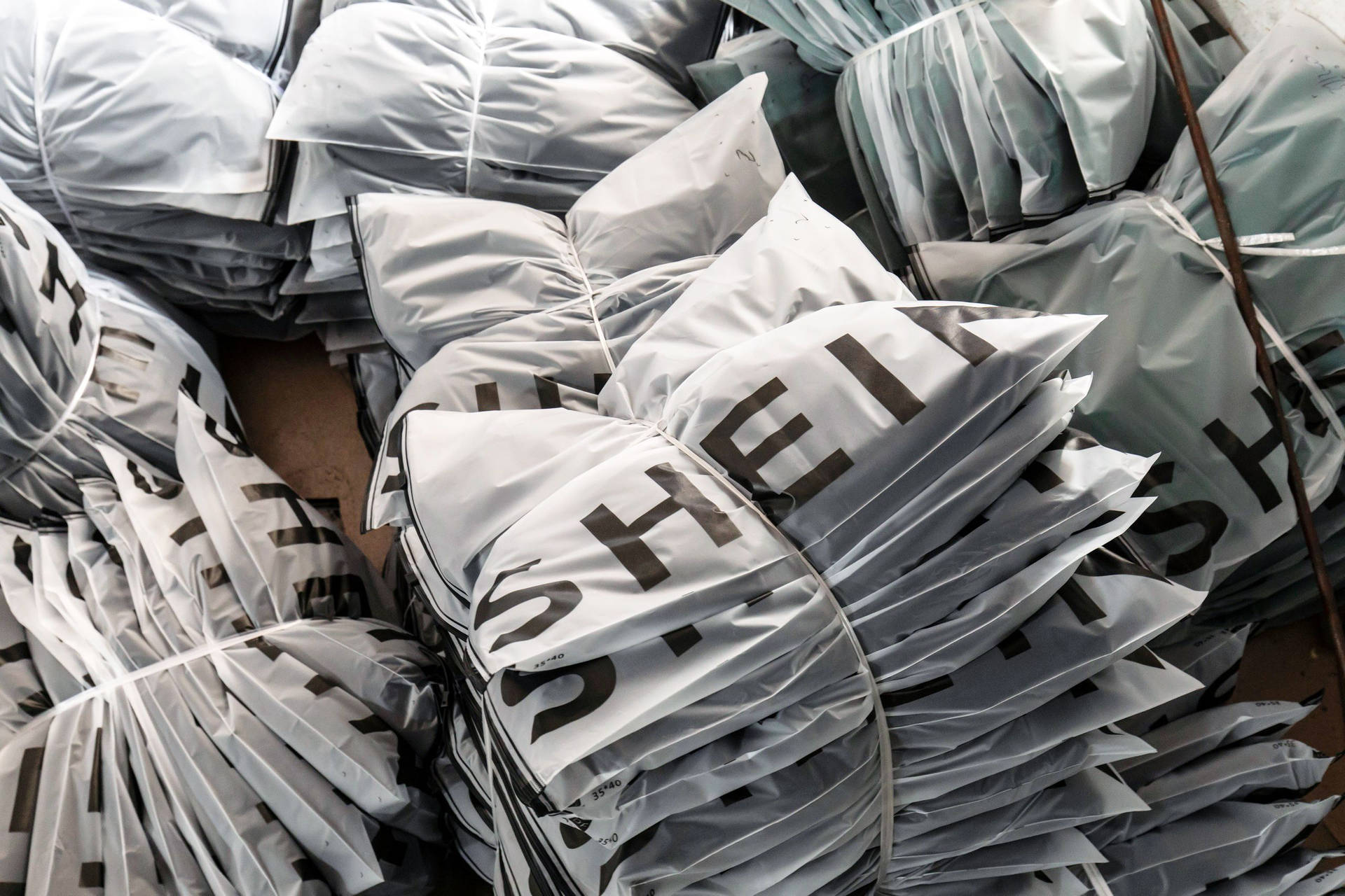 Download Piles Of Shein Plastic Bags Wallpaper