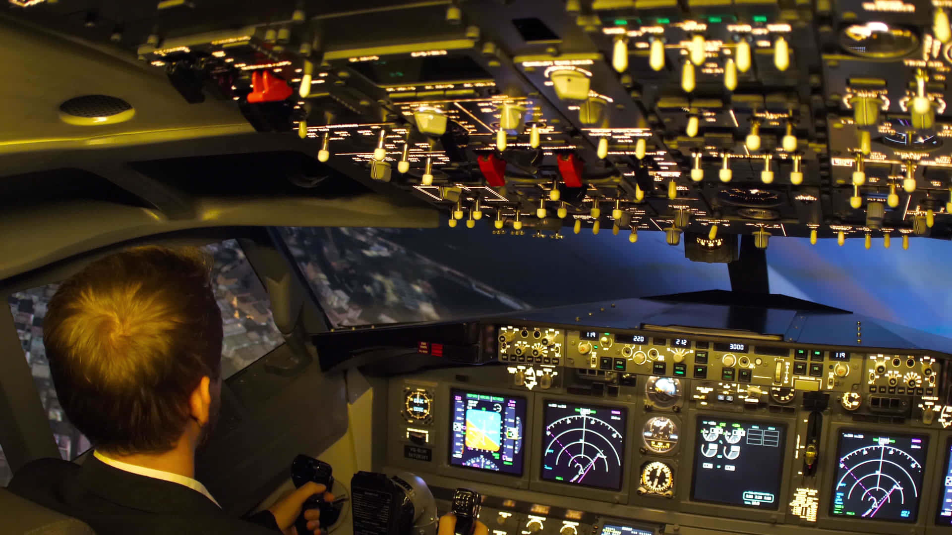 Pilot Navigating Inside Airplane At Night Wallpaper