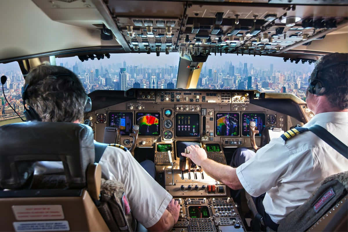 Two Pilot Flying Over City Picture