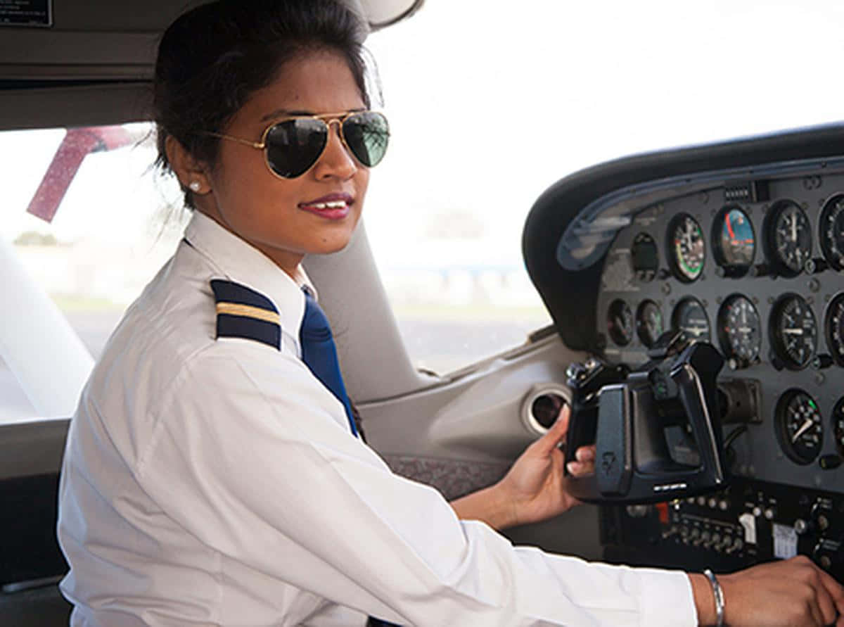 Woman Pilot Operating Airplane Picture