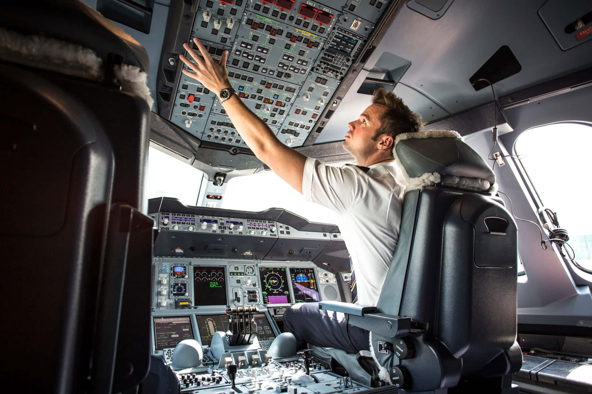 Male Pilot Operating Airplane Picture