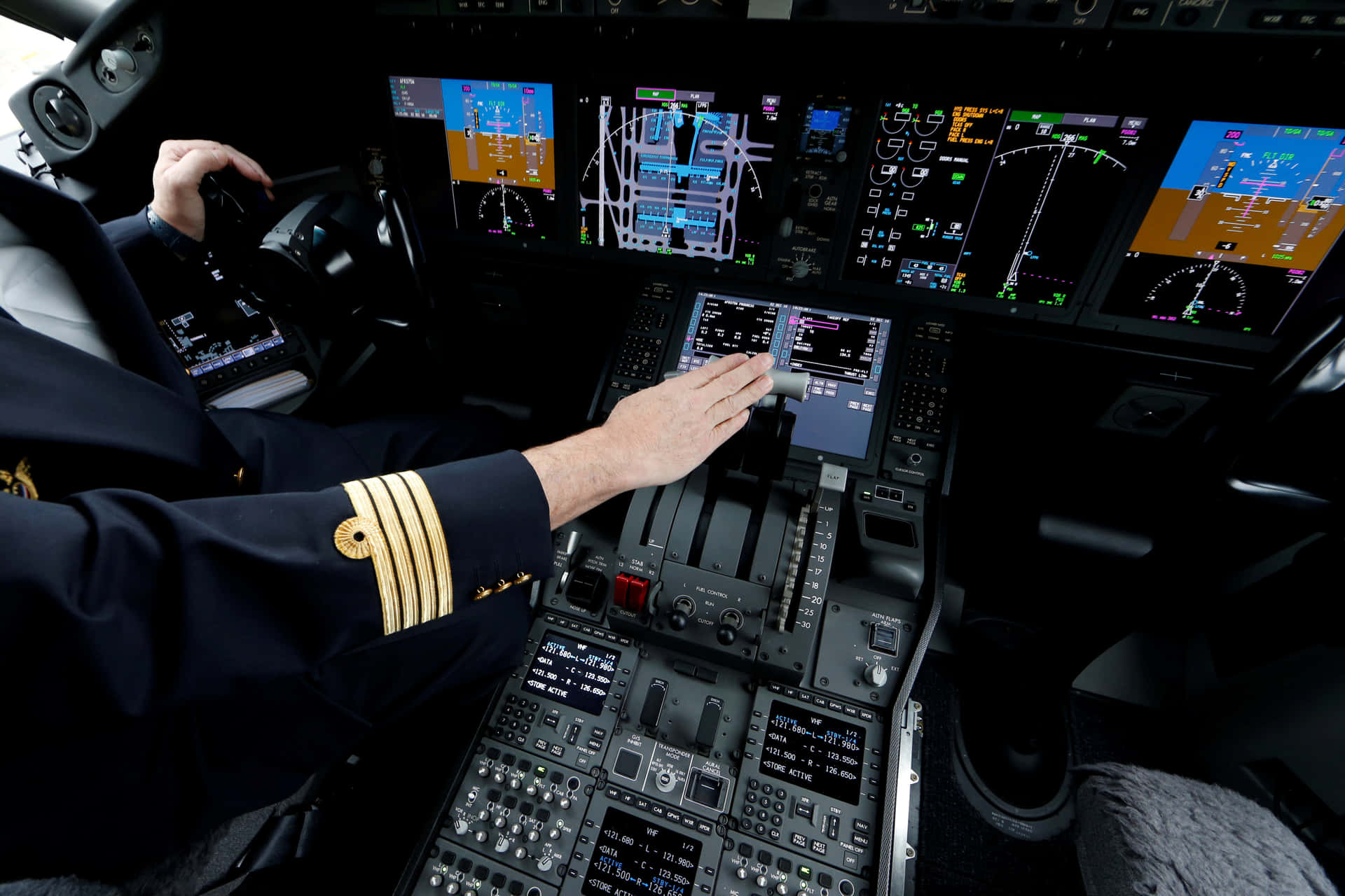 Pilot Operating In Plane Cockpit