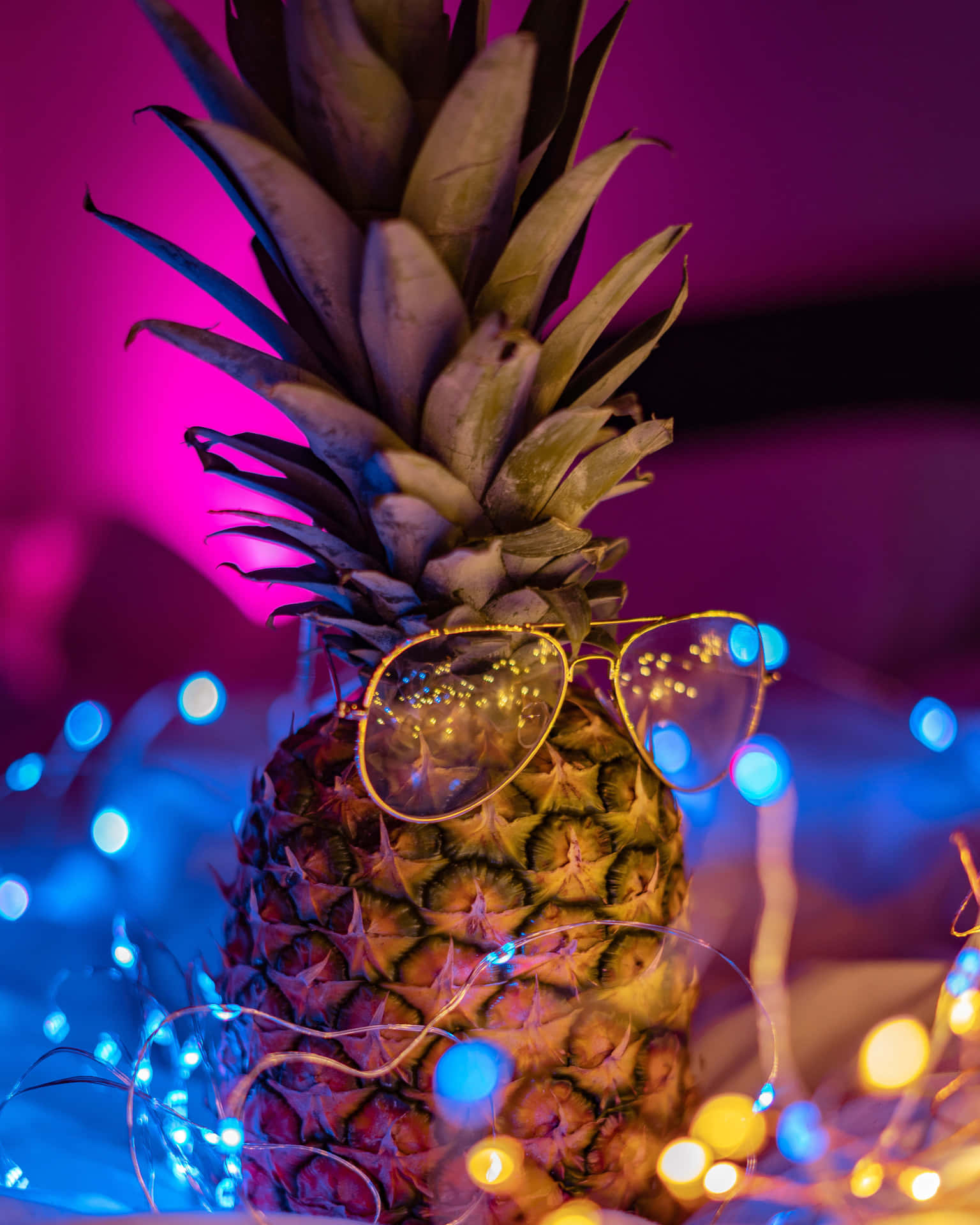 A Pineapple With Glasses On It