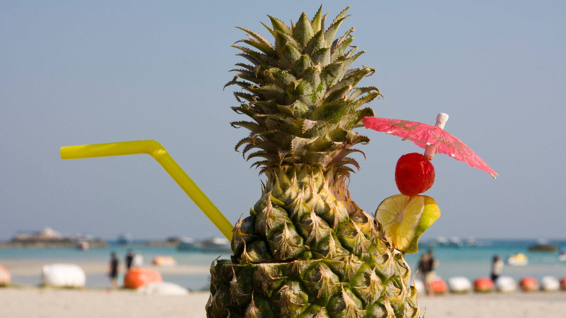 Enjoying a Pineapple Beach Cocktail on a Sunny Day Wallpaper