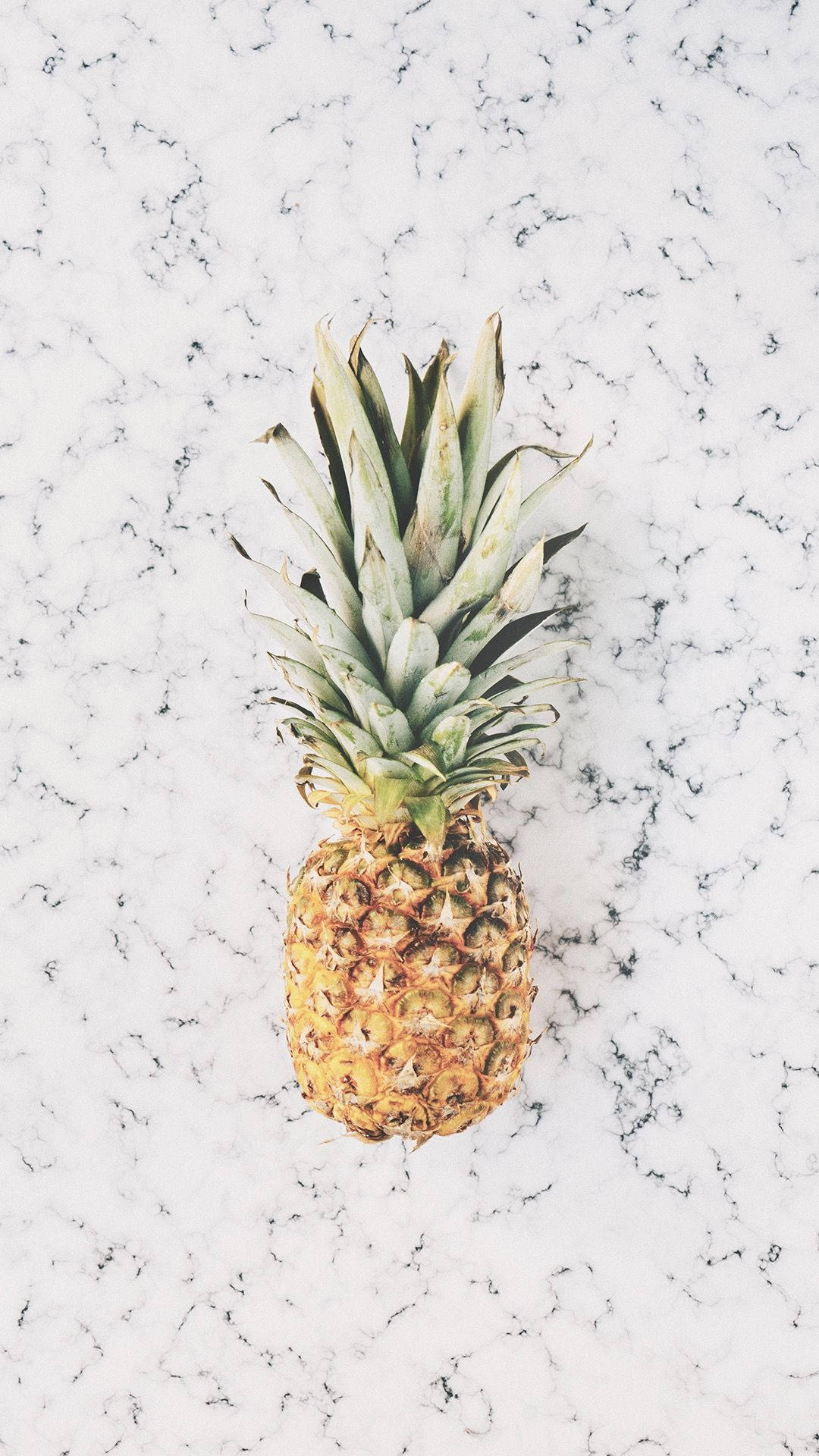 Close-Up of Pineapple Against a Marble Background Wallpaper