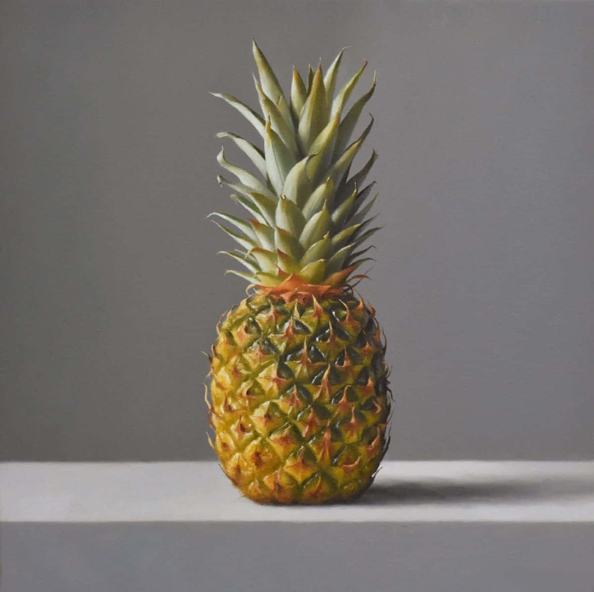 Etmaleri Af En Ananas På Et Bord.