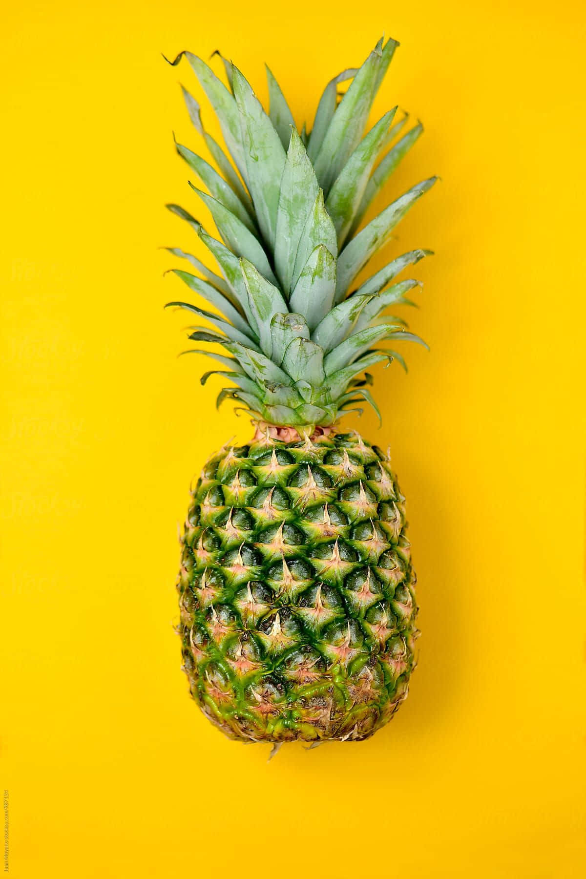 A Pineapple On A Yellow Background