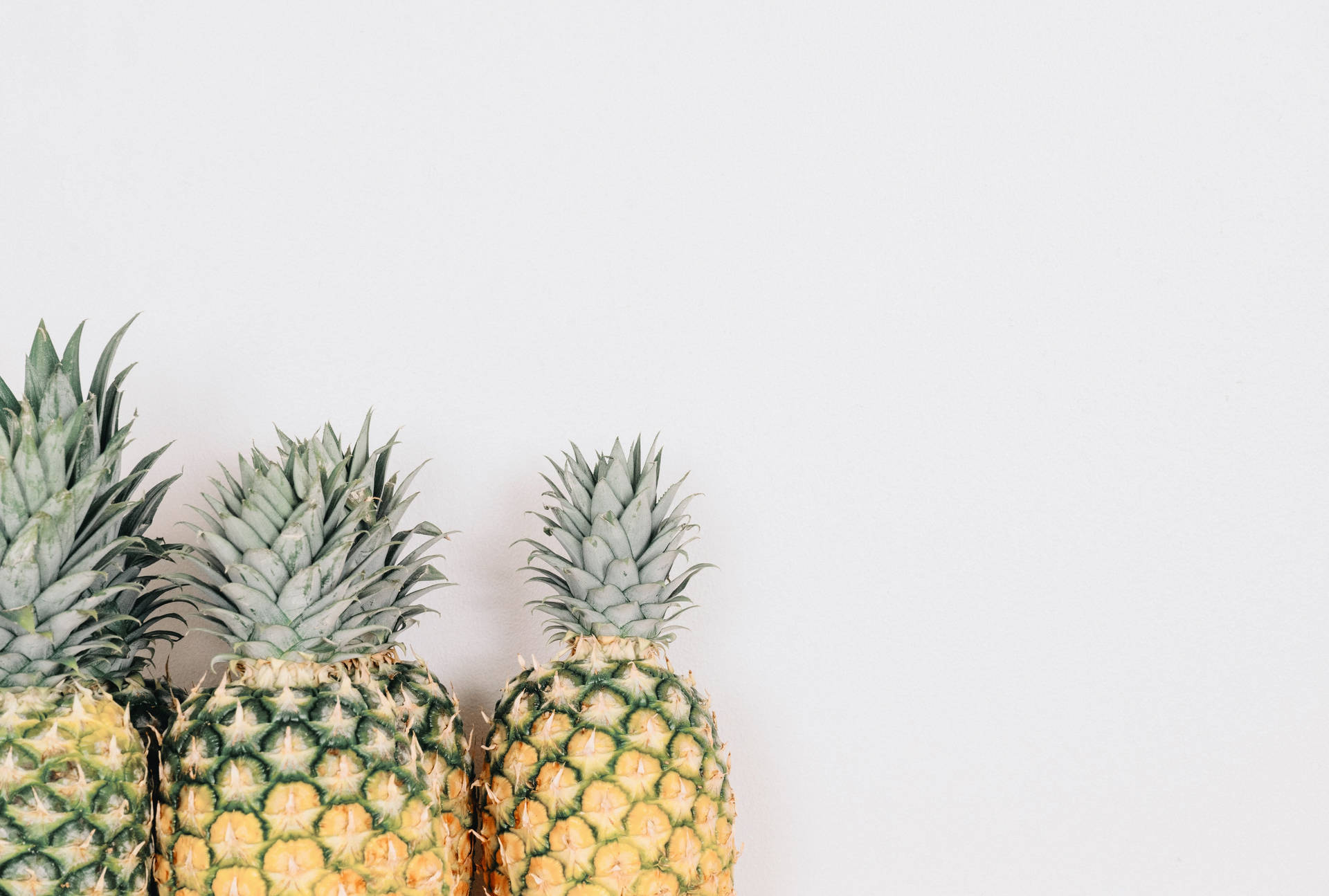 Pineapples On White Background Wallpaper