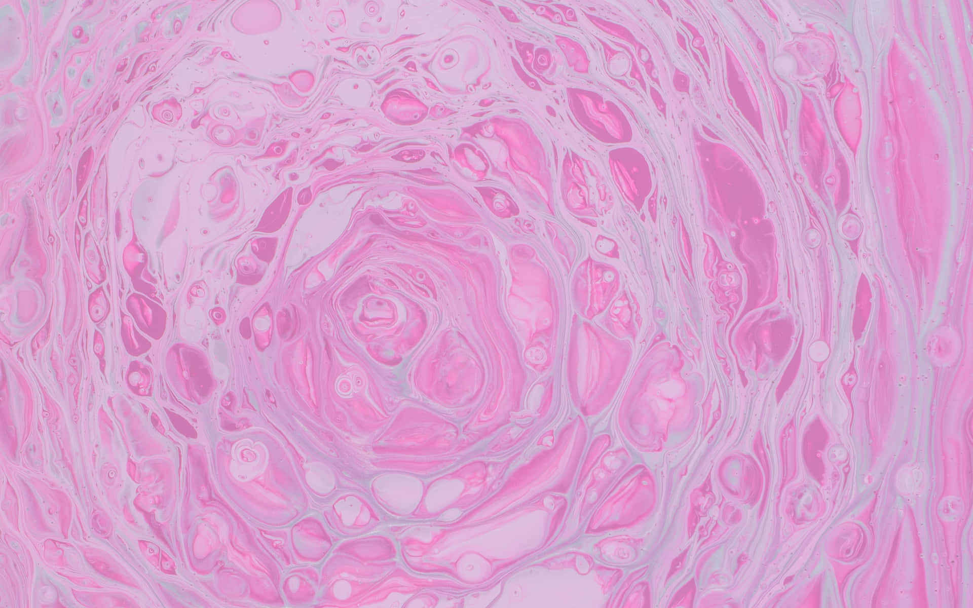 A Pink Swirl Of Liquid With A Swirl Of Bubbles