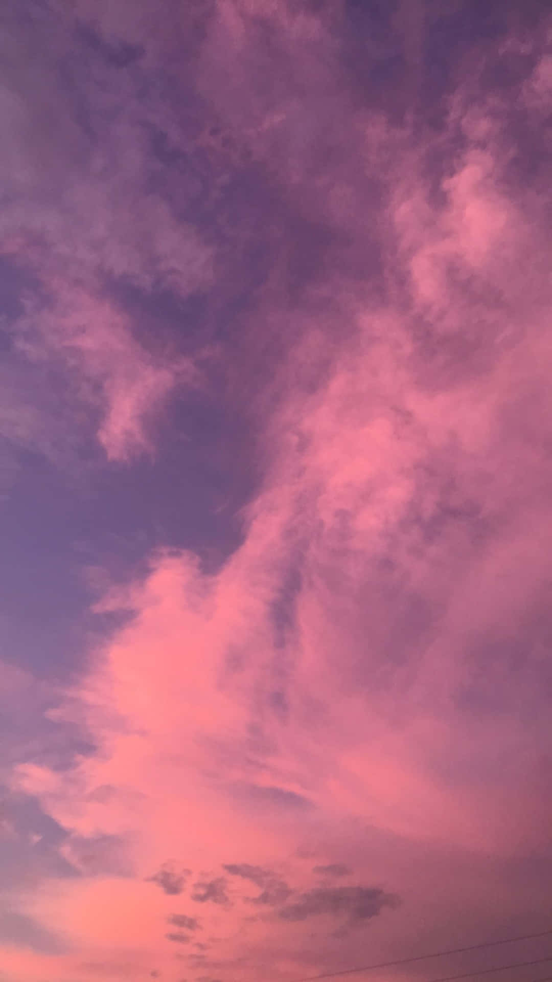 Make your nostalgic moments brighter with the beautiful "Pink Aesthetic iPhone" wallpaper Wallpaper