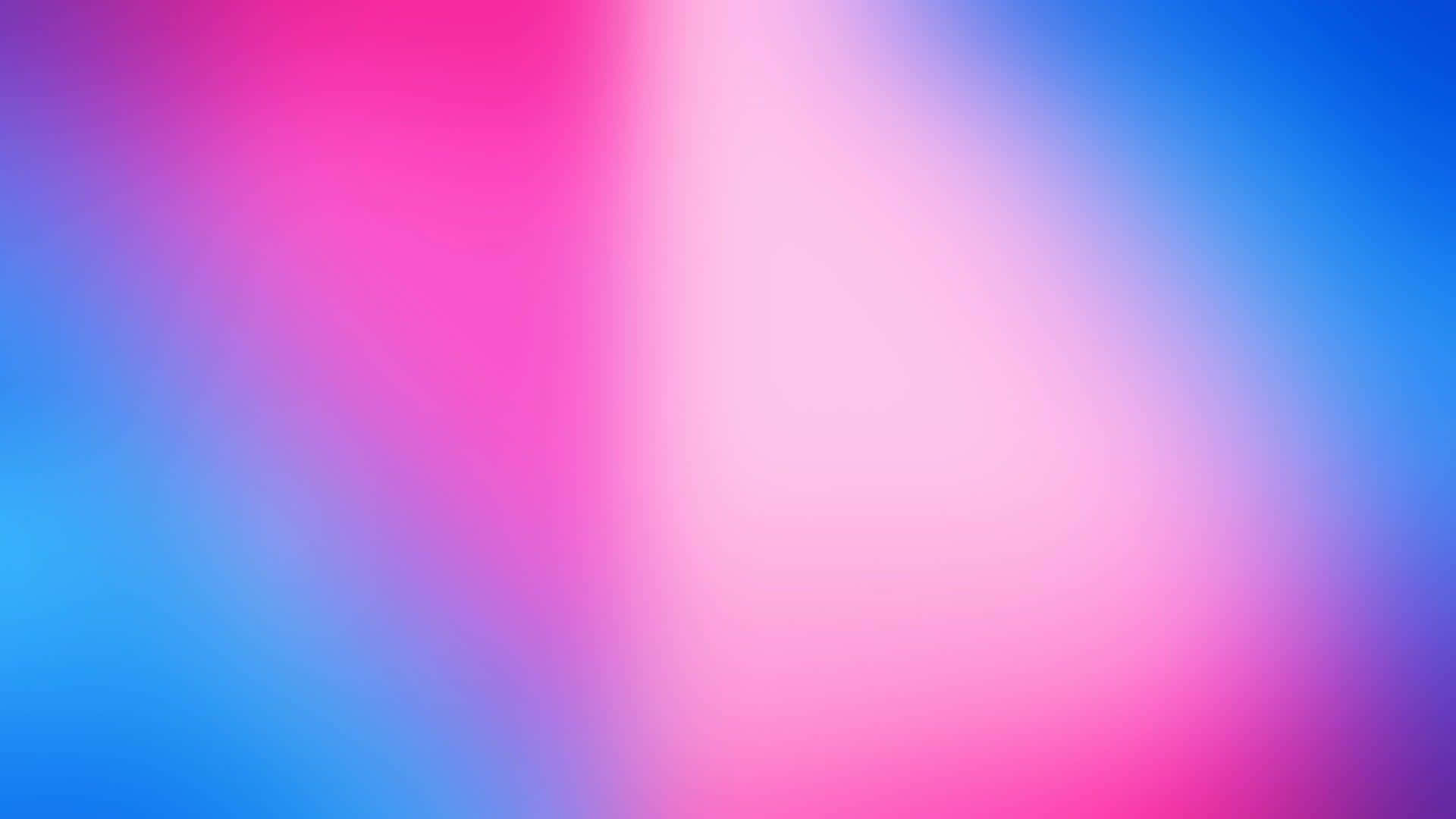 a blurred background with pink and blue colors