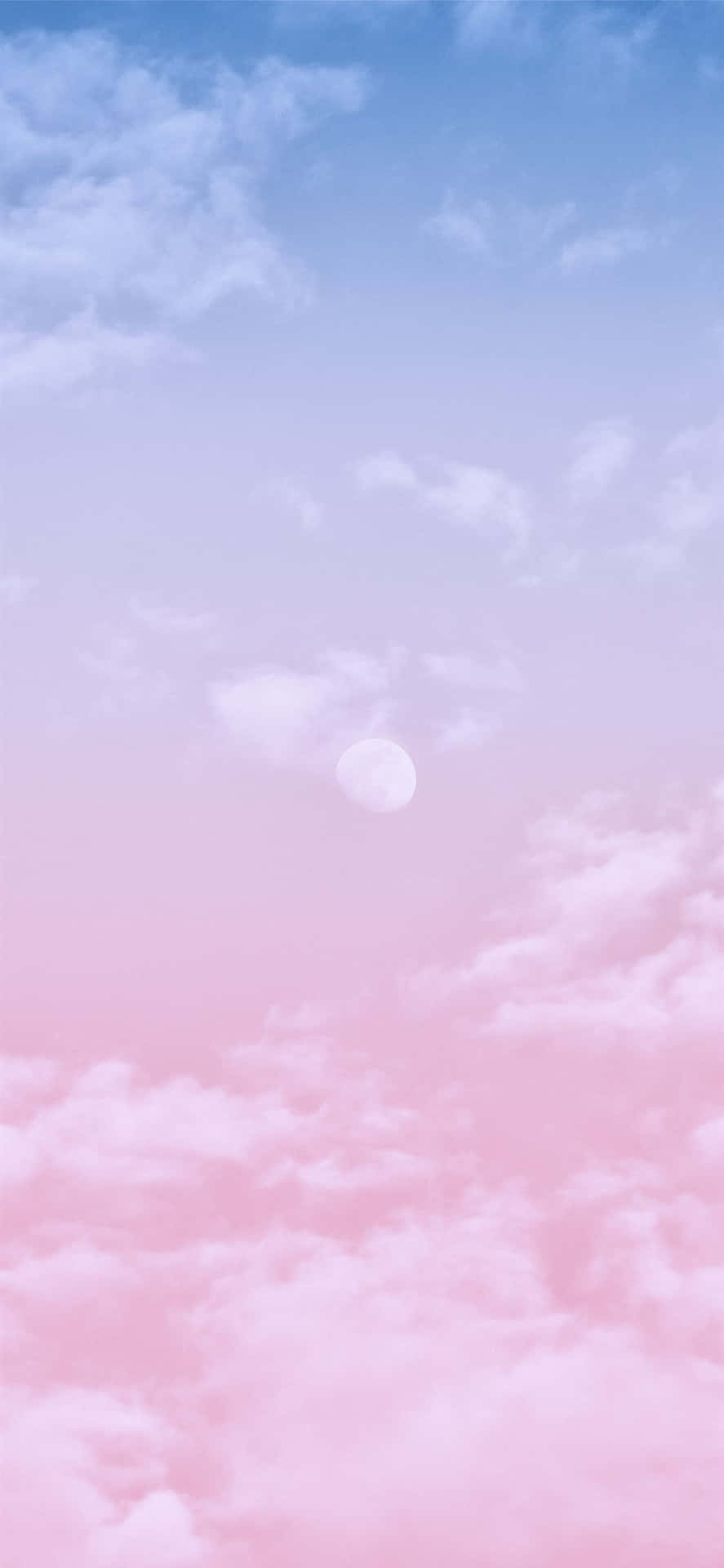 Majestic pink and blue clouds as the sun sets Wallpaper