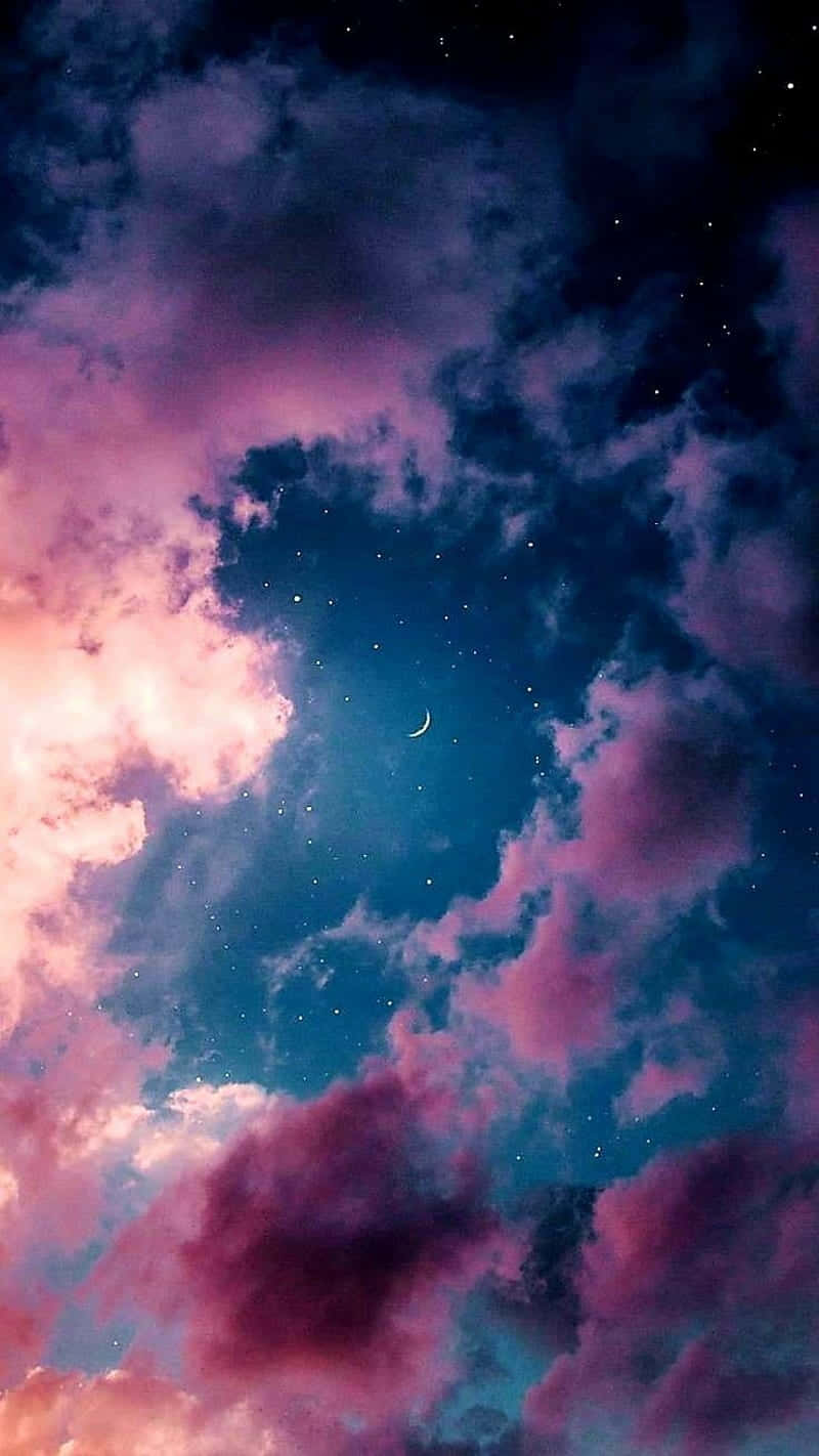 Umaimpressionante Paisagem Celestial Apresentando Nuvens Rosa E Azul Vivas. Papel de Parede