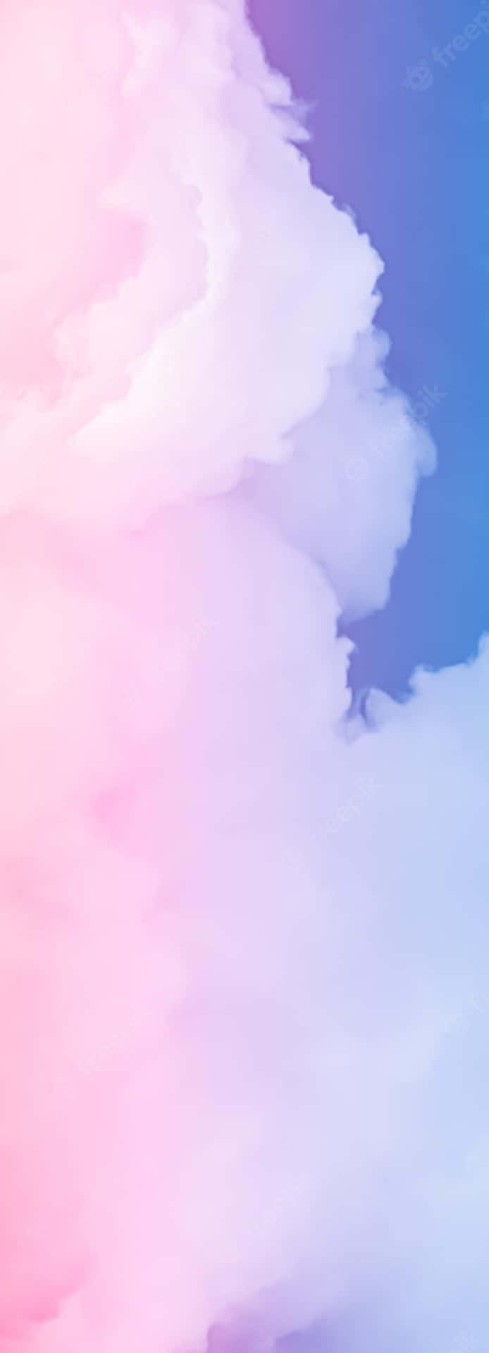 A captivating landscape of pink and blue clouds in the sky. Wallpaper