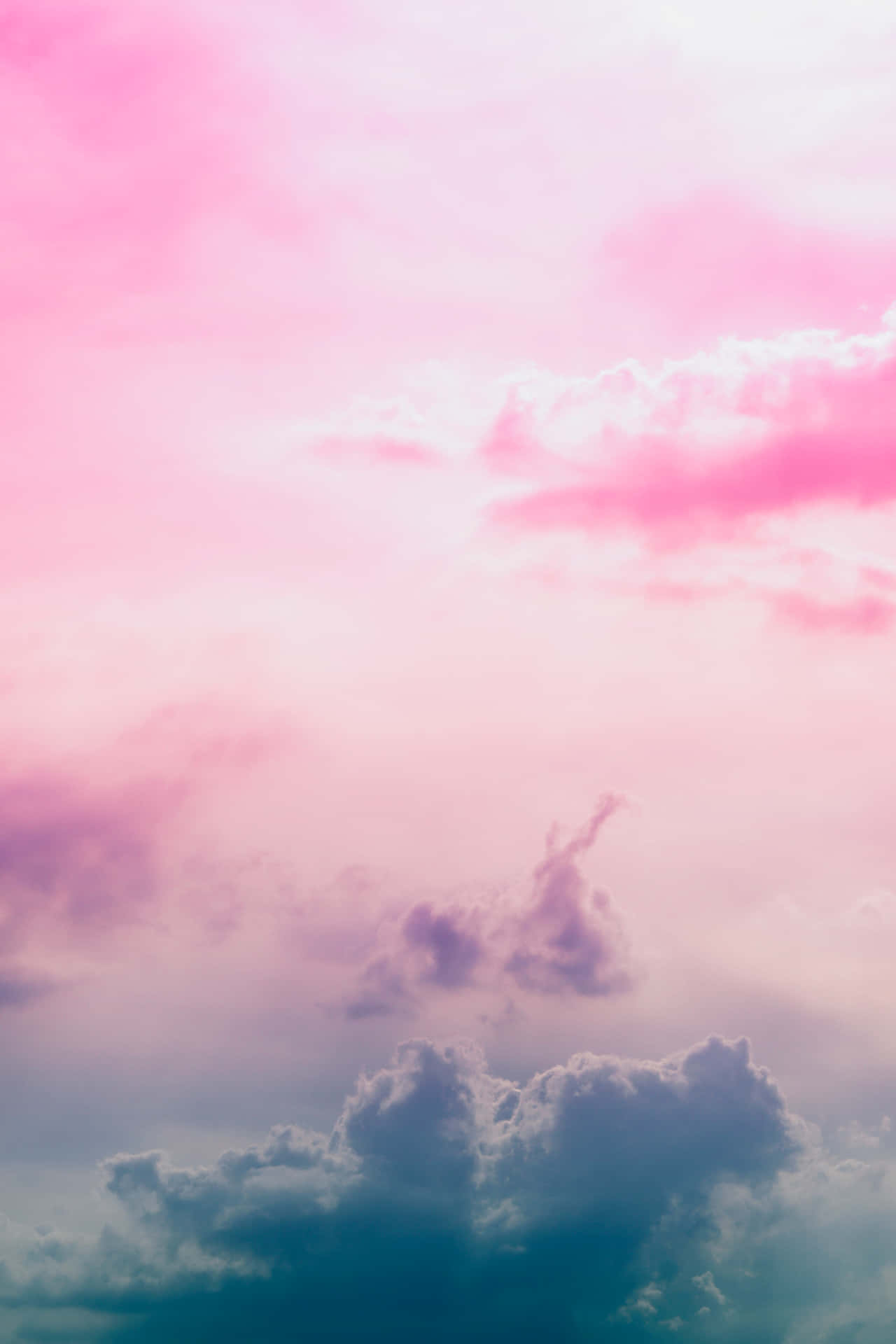 A beautiful view of pink and blue clouds in the sky Wallpaper
