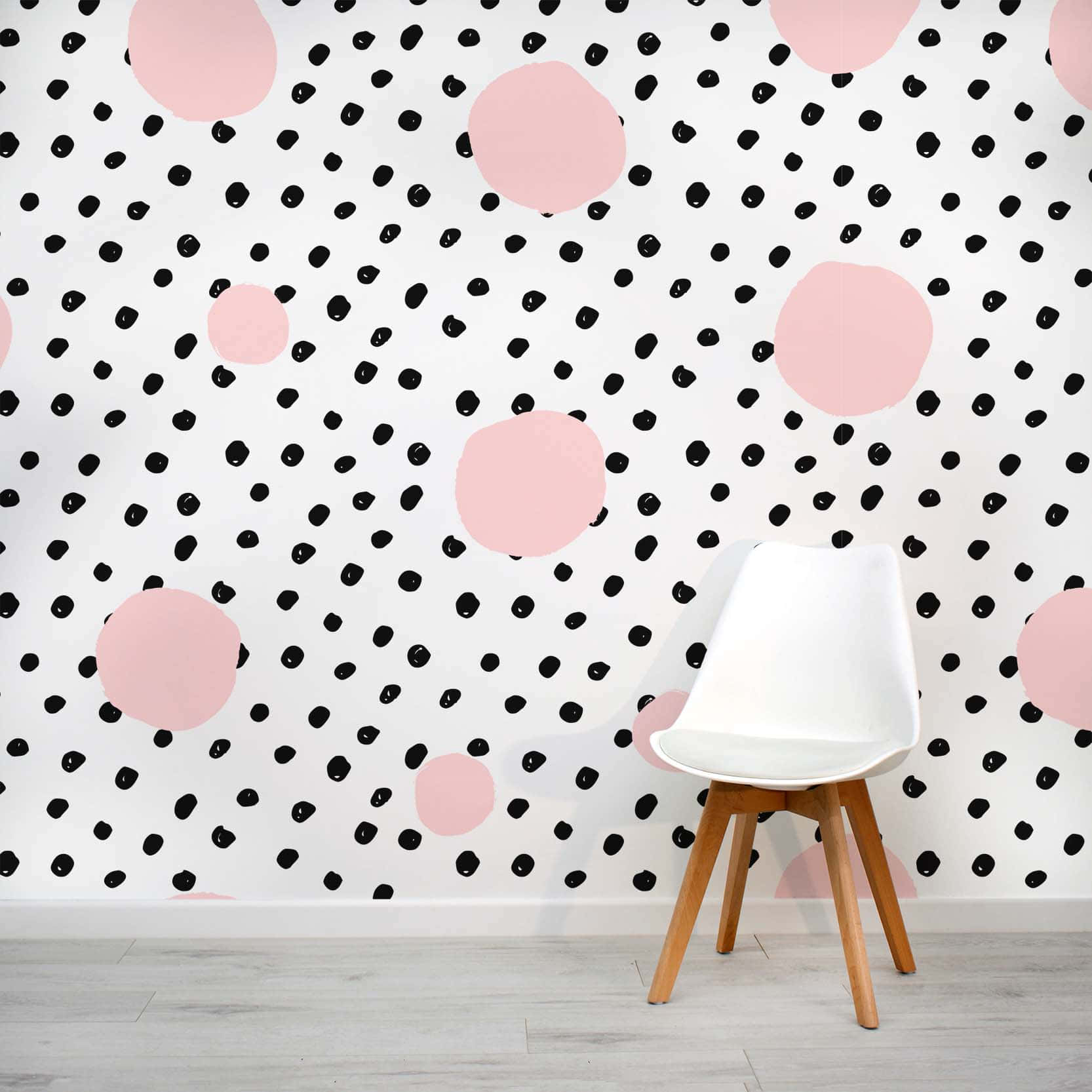 En pink og hvid mønster af polka prikker. Wallpaper