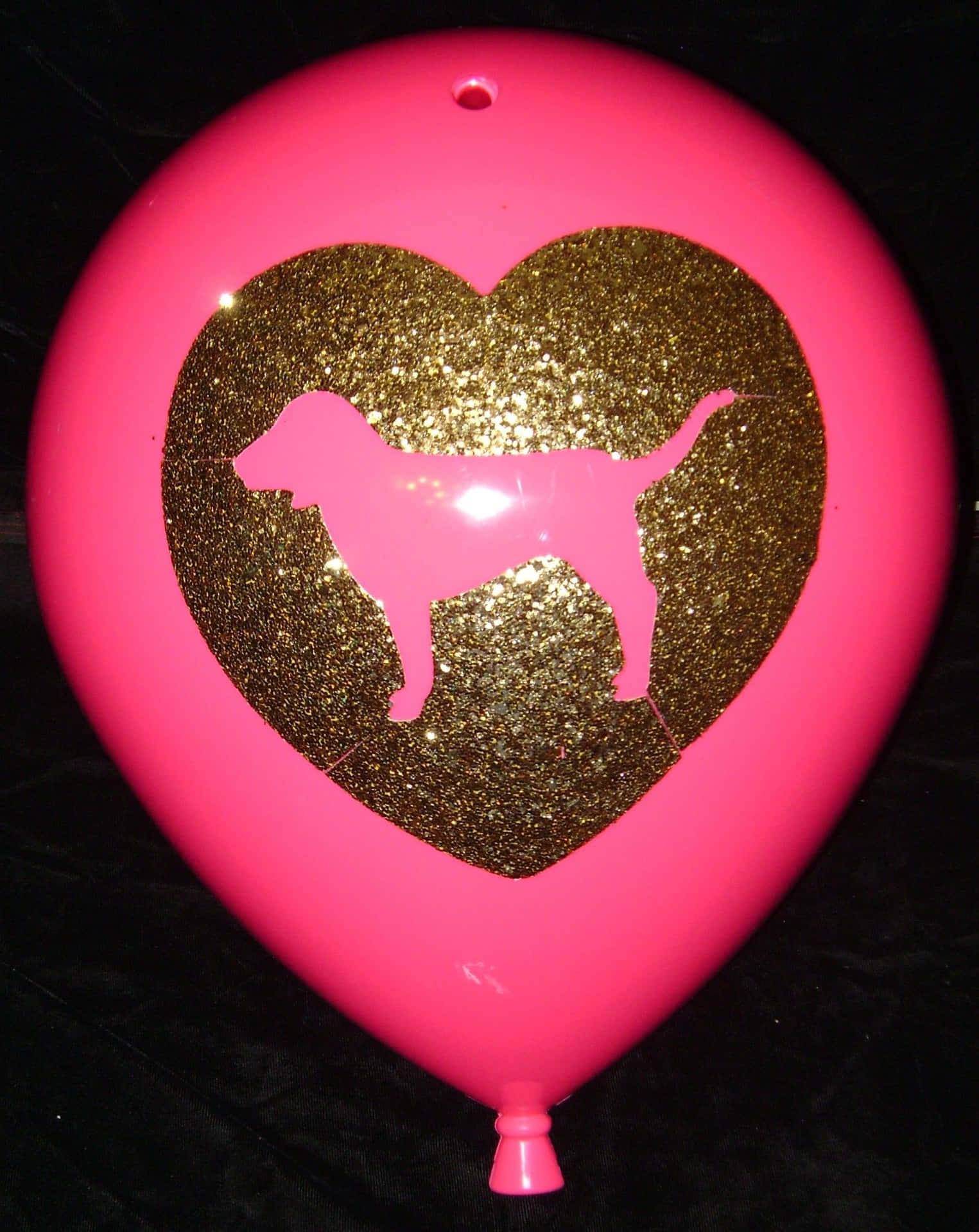 A Pink Balloon With A Gold Heart