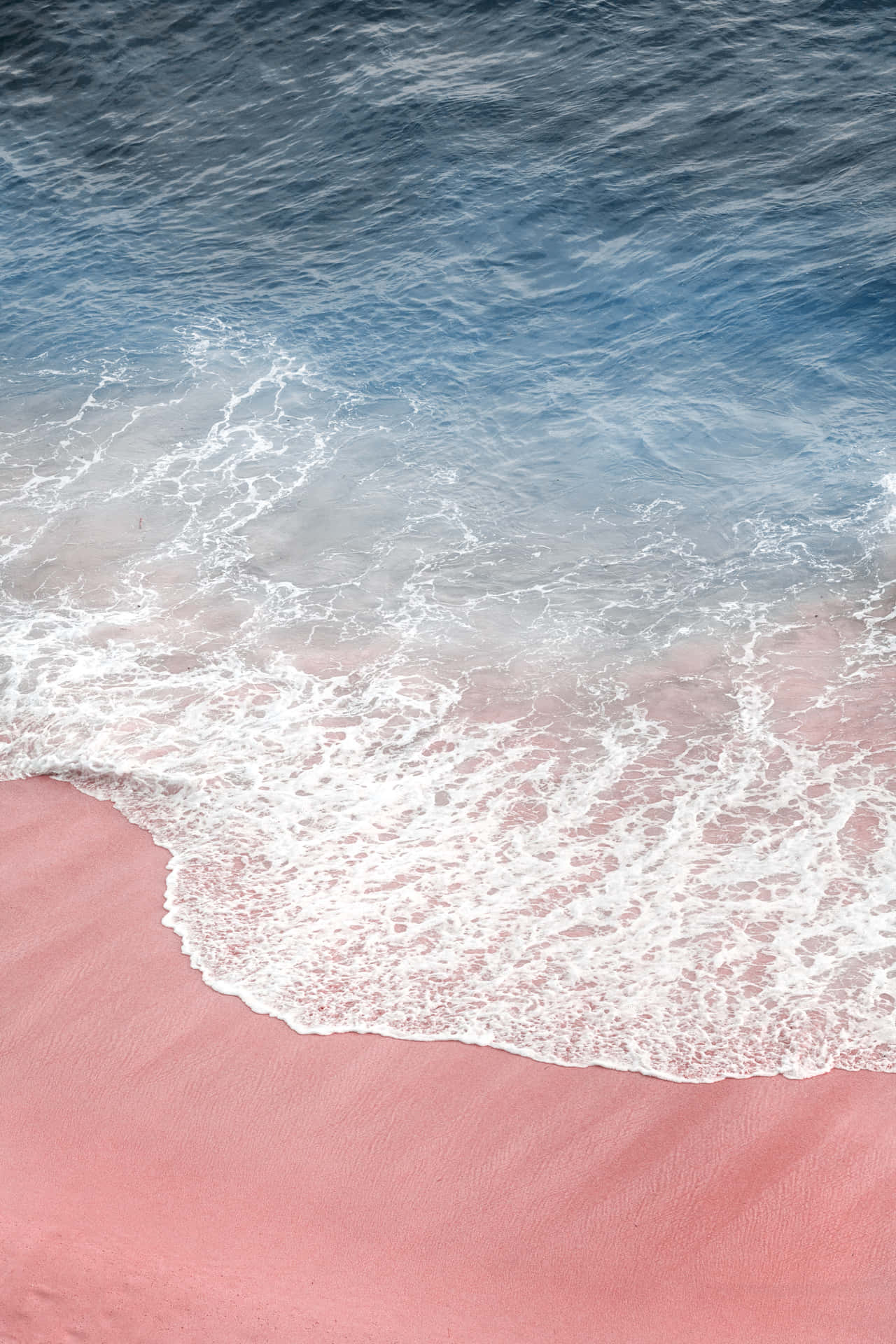 Enjoy the Soft, Dreamy Hues of a Pink Beach Aesthetic Wallpaper