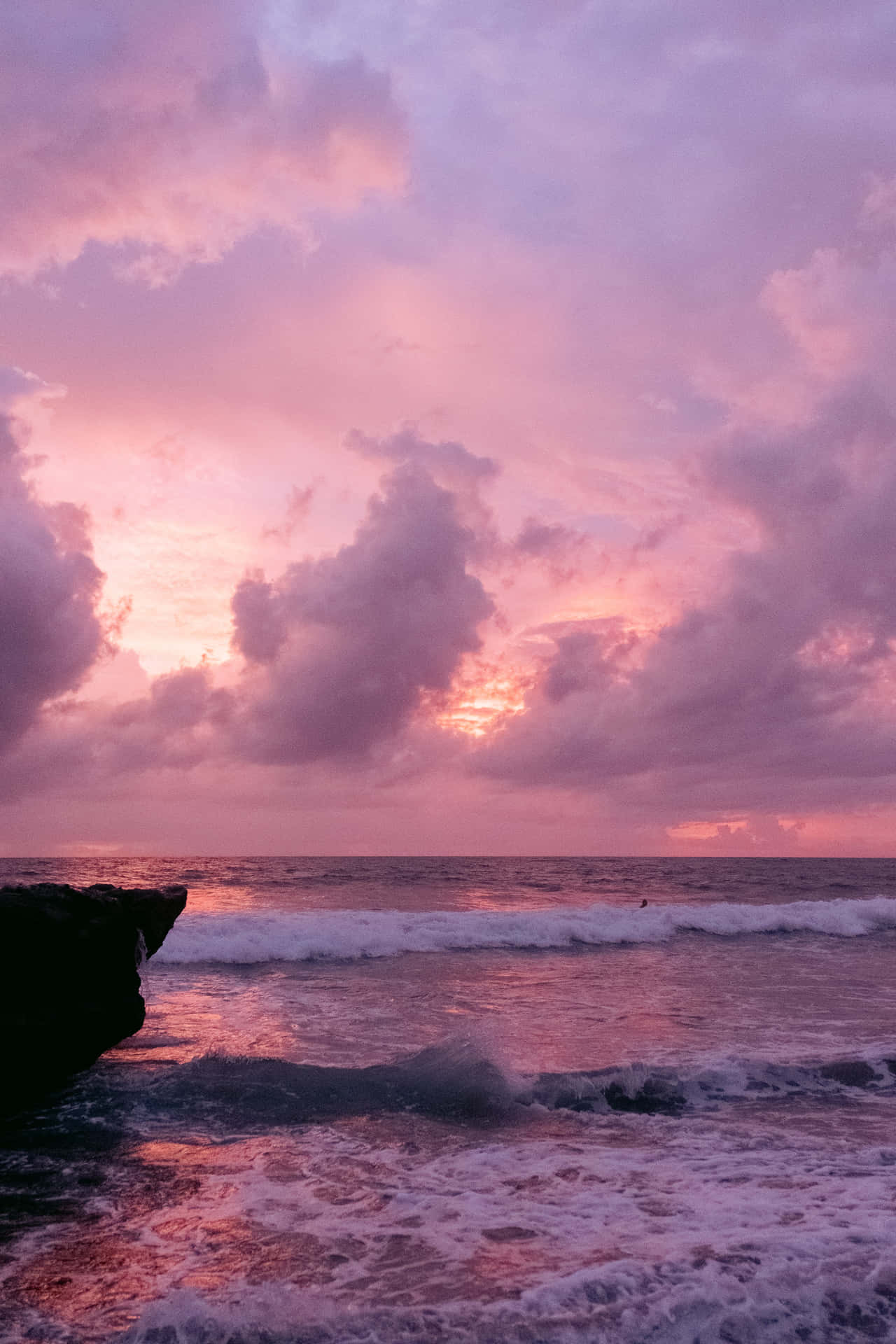 Pink Beach Sunset With Heavy Waves Wallpaper
