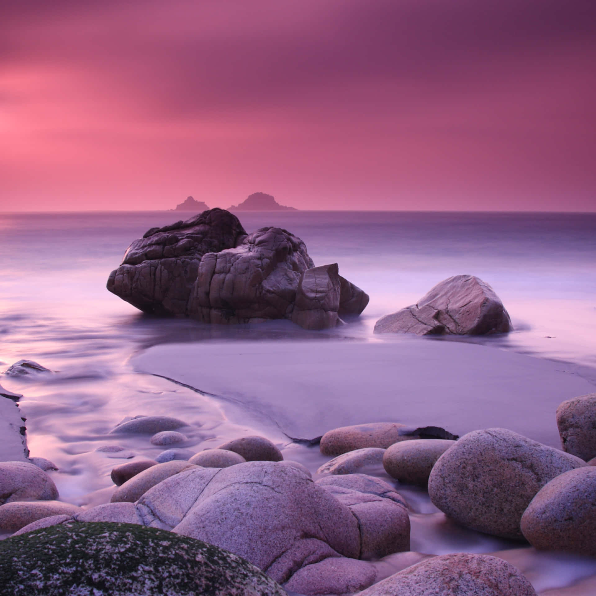 Download Pink Beach Sunset With Rocks Wallpaper