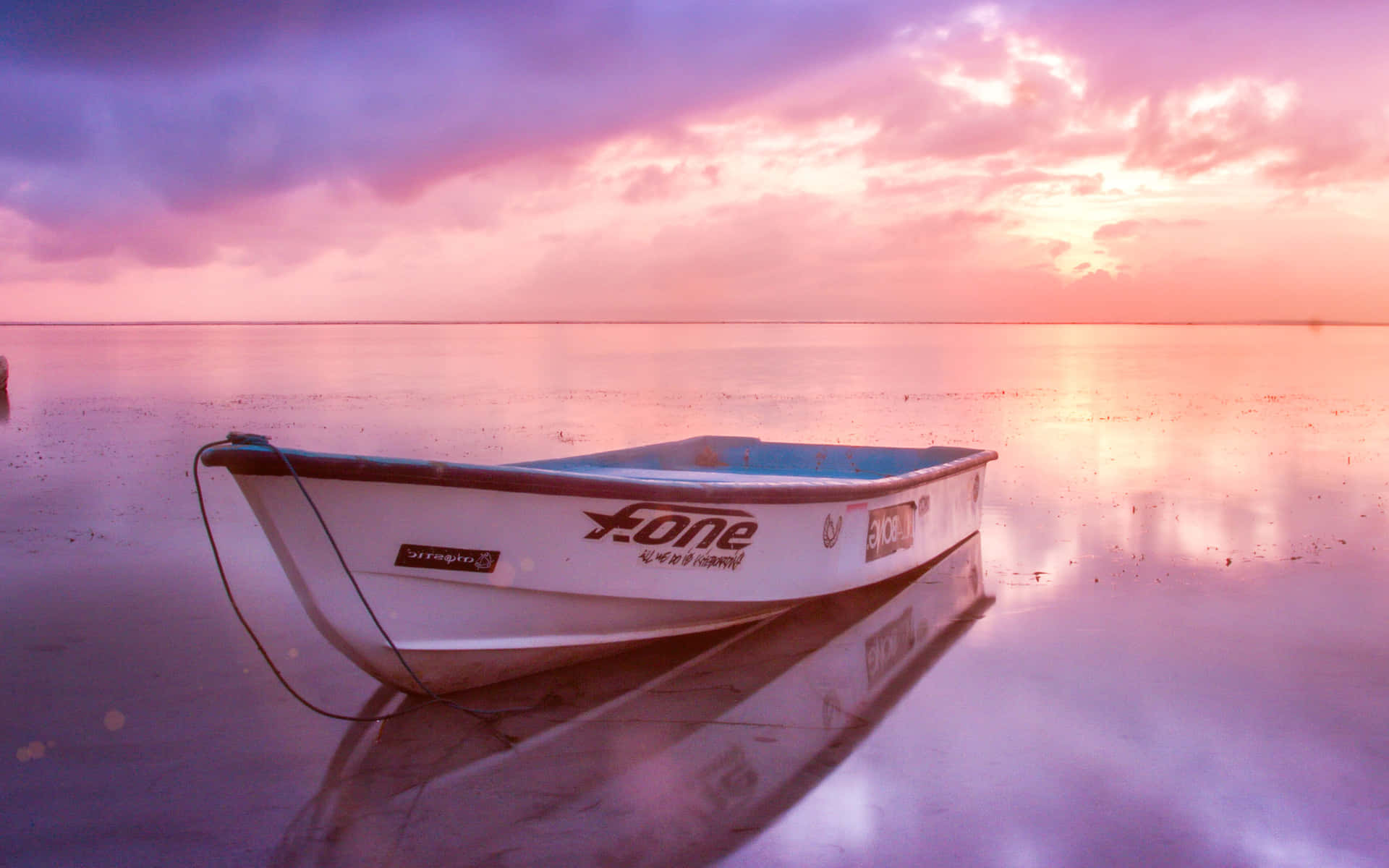 Pink Beach Sunset With A White Boat Wallpaper