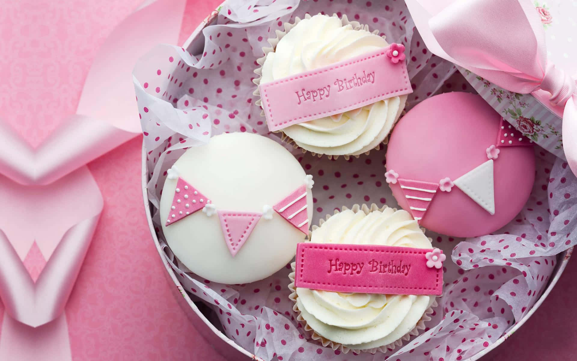 A Box Of Cupcakes With Pink Ribbons And Bows Wallpaper