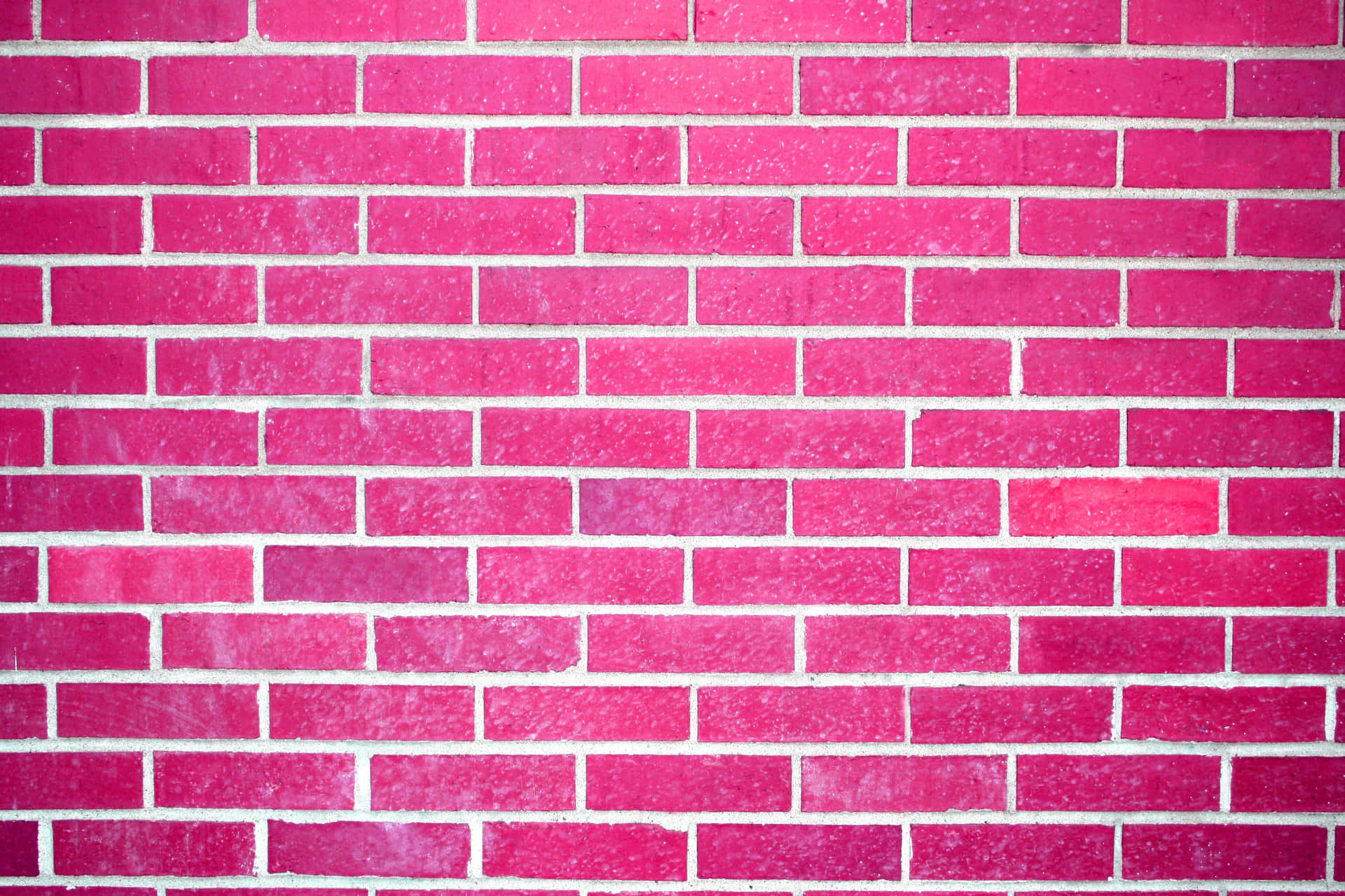 A Pink Brick Wall With A White Background