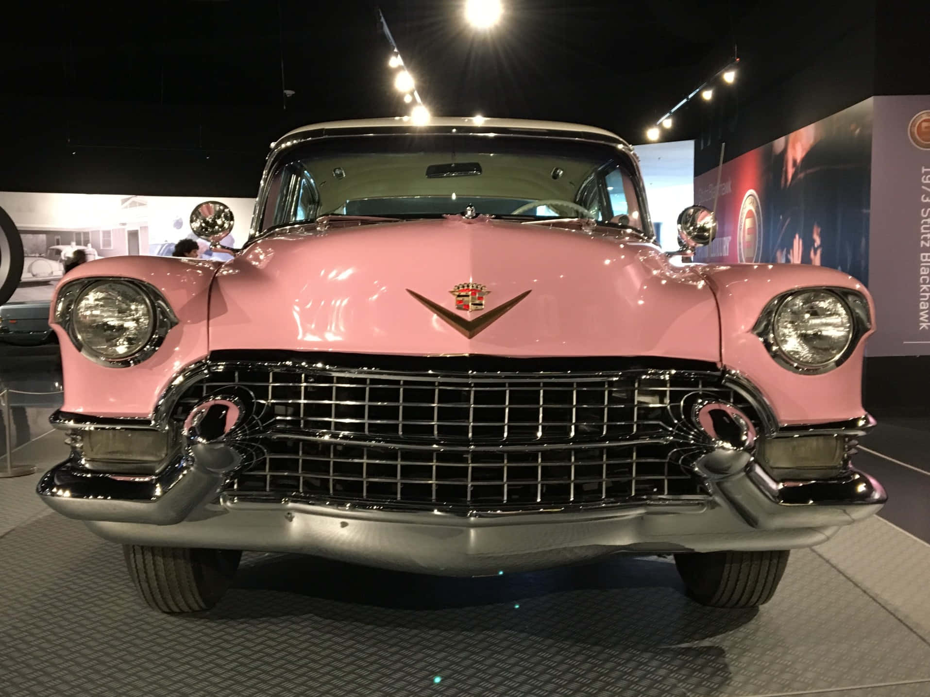 Classic Pink Cadillac cruising in style Wallpaper