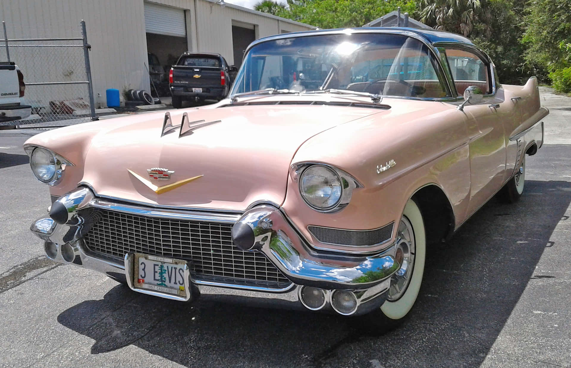 Vintage Pink Cadillac in Scenic Location Wallpaper