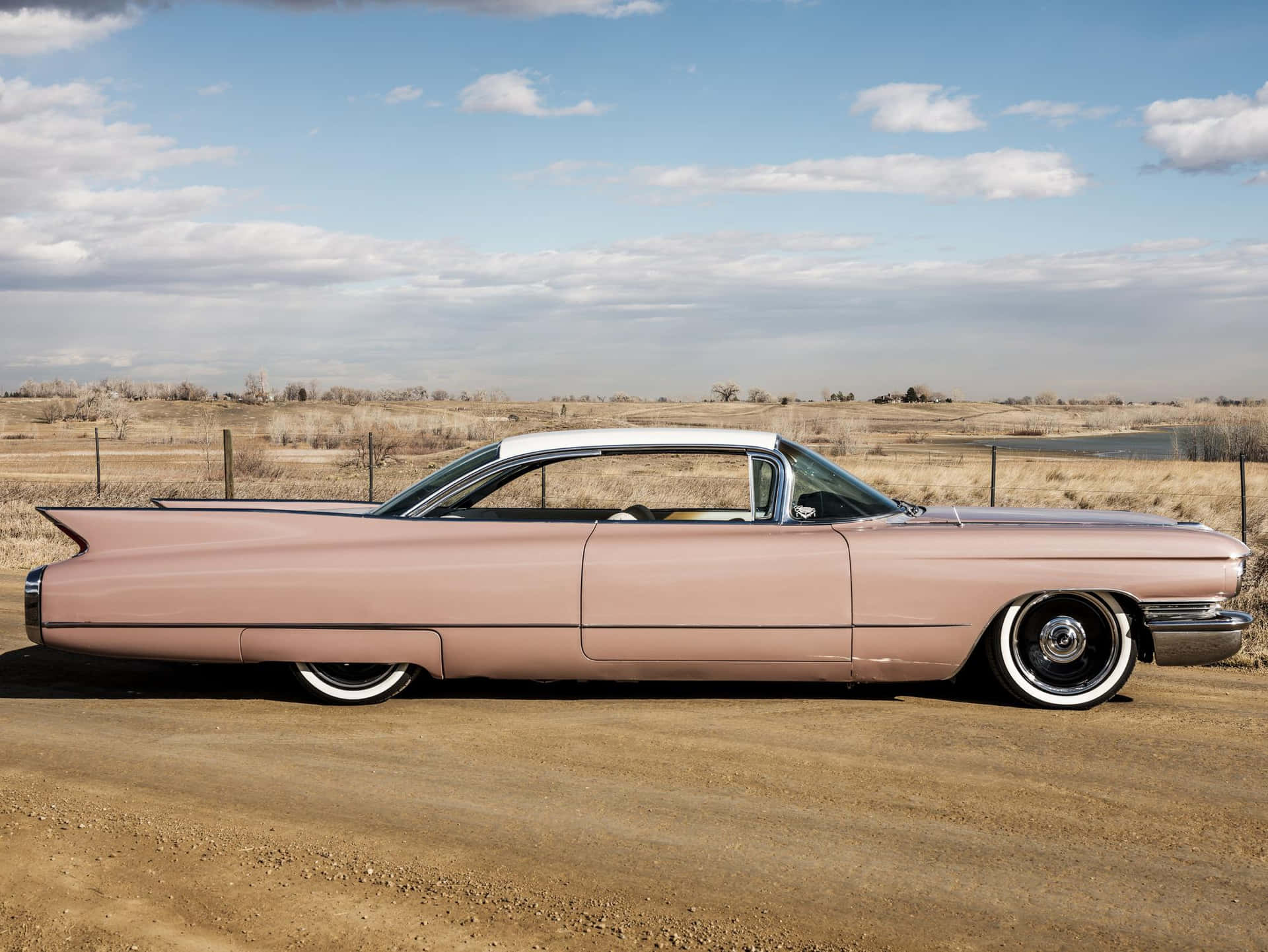 Vintage Pink Cadillac shining in all its glory Wallpaper