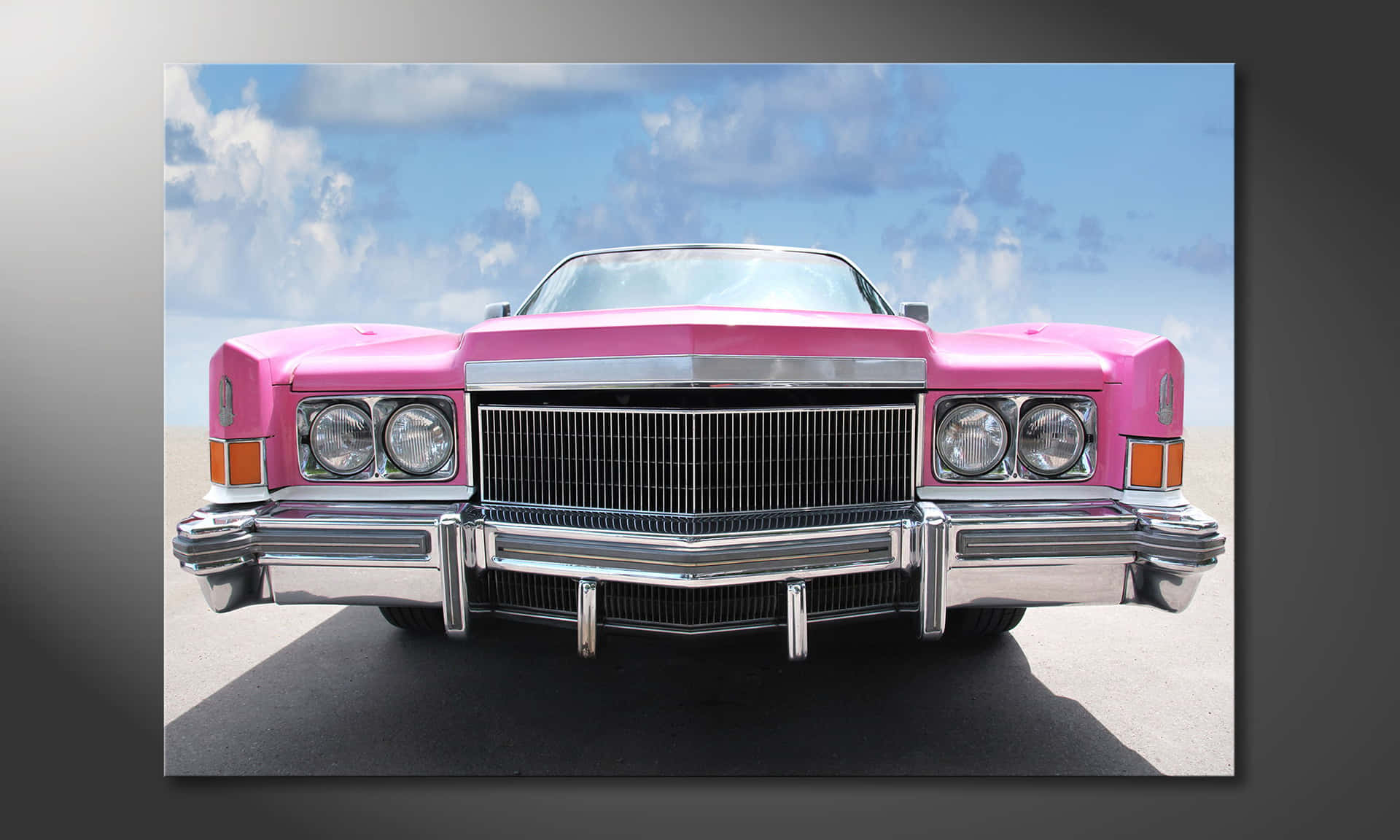 Pink Cadillac Cruising Down the Street Wallpaper