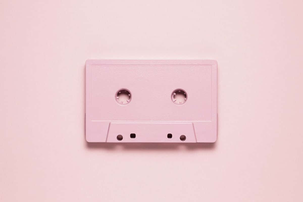 Pink Cassette Tapeon Pastel Background Wallpaper