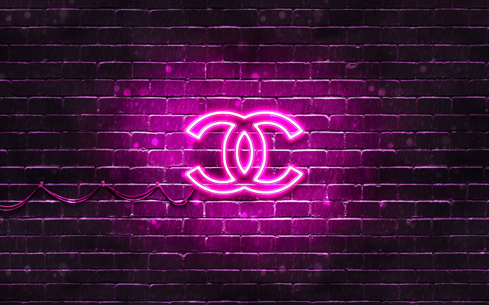 Ljustrosa Chanel-logotyp. Wallpaper