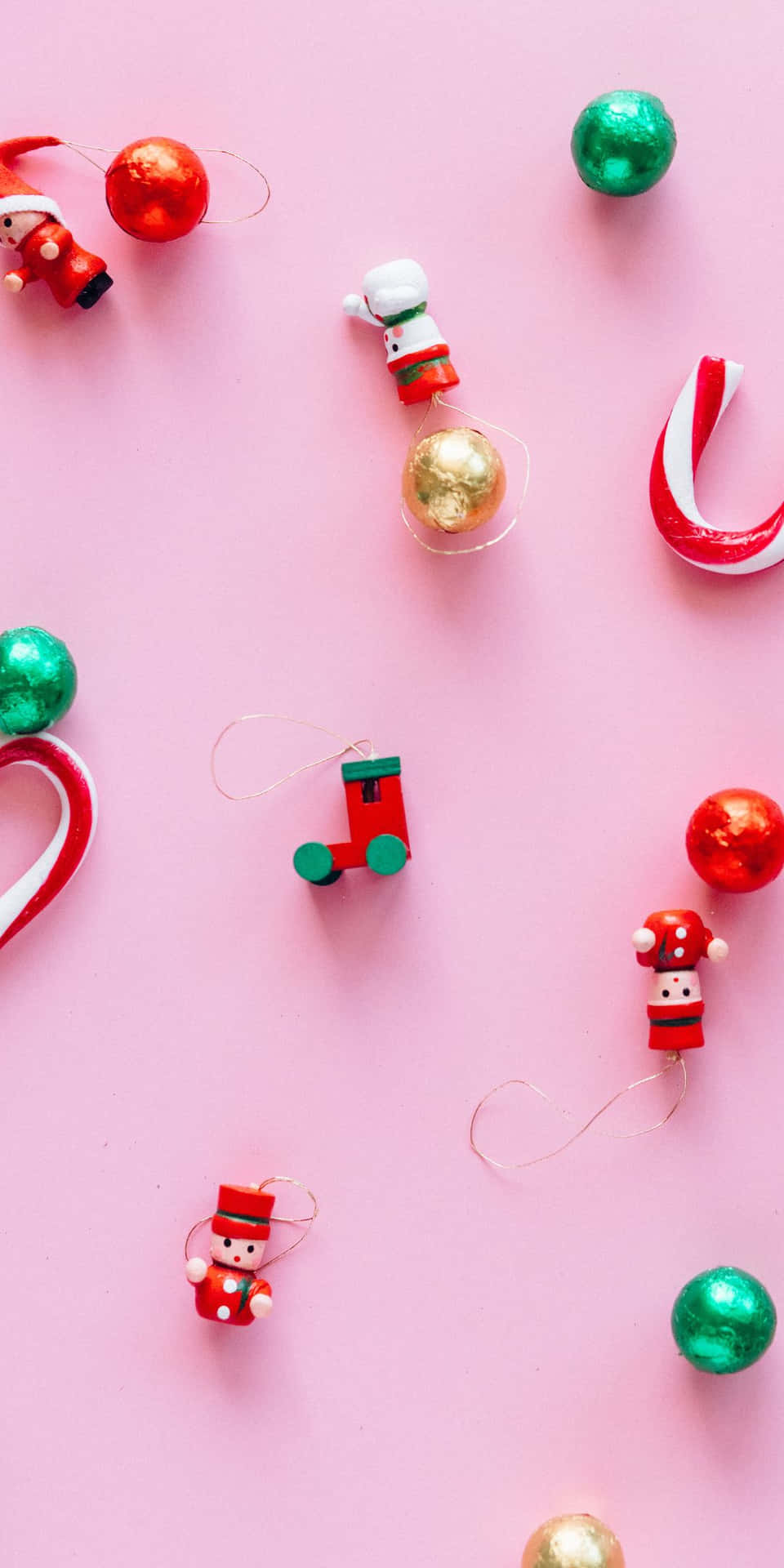Get into the holiday spirit with a festive pink Christmas background