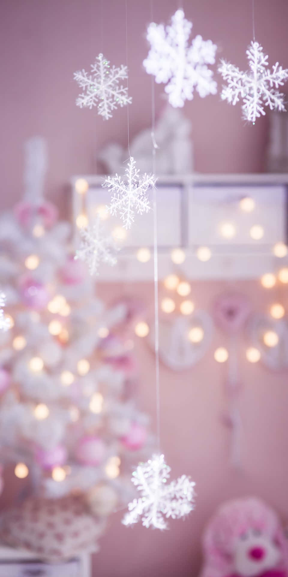 A Room With Snowflakes Hanging From The Ceiling