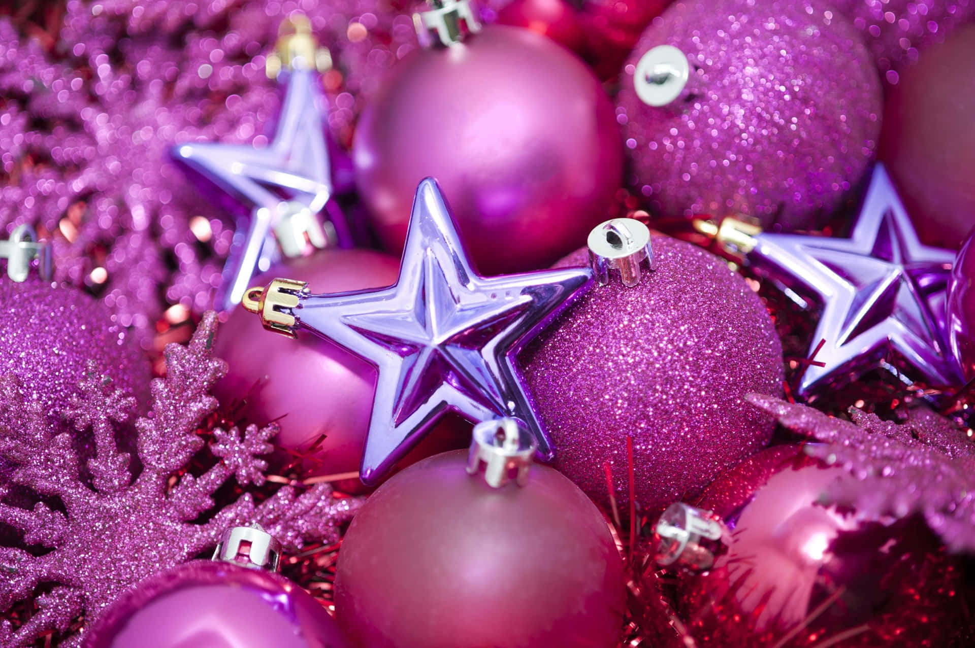 Pink Christmas Ornamentsand Stars Wallpaper