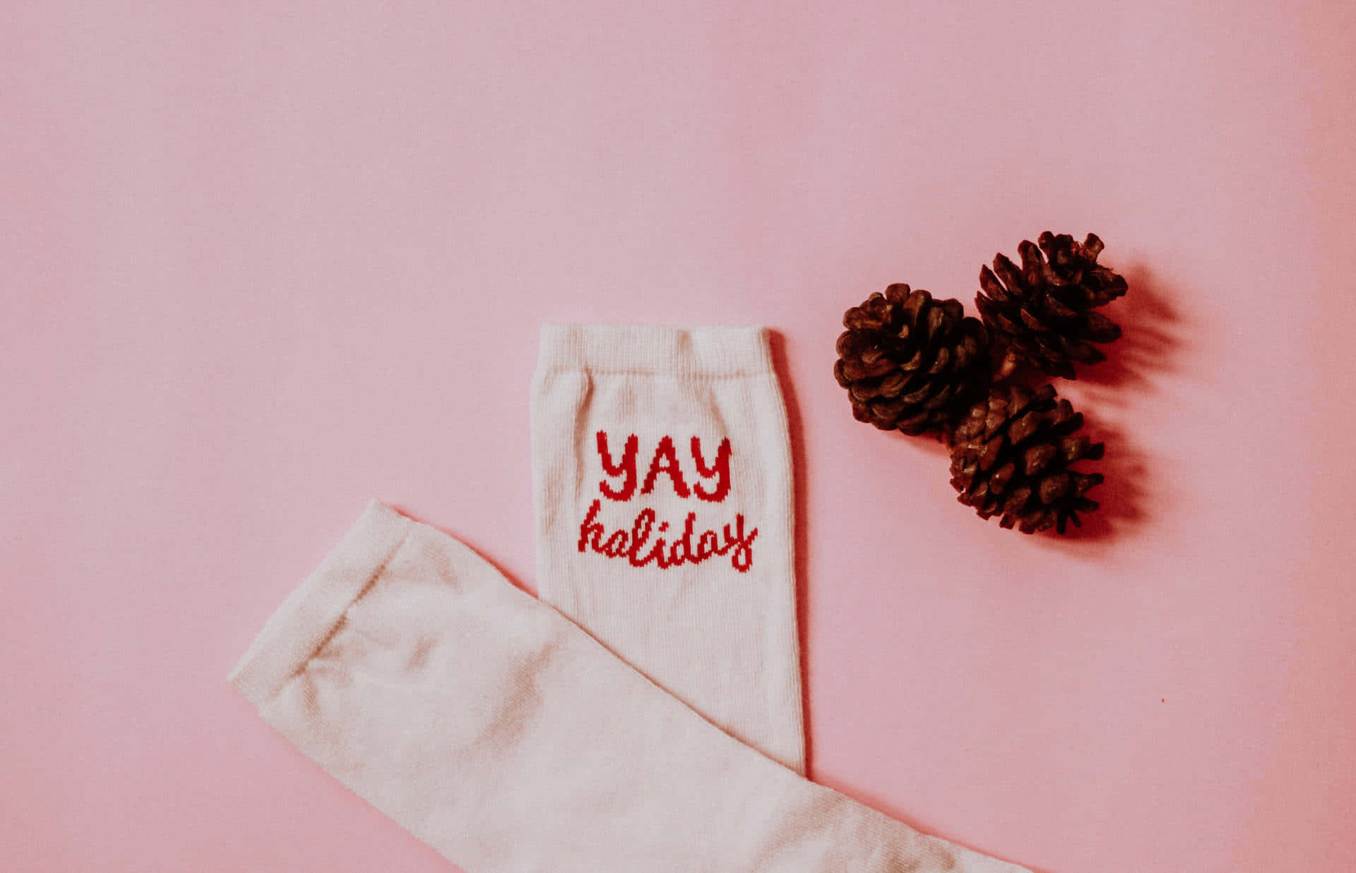 Pink_ Christmas_ Sock_and_ Pinecones Wallpaper