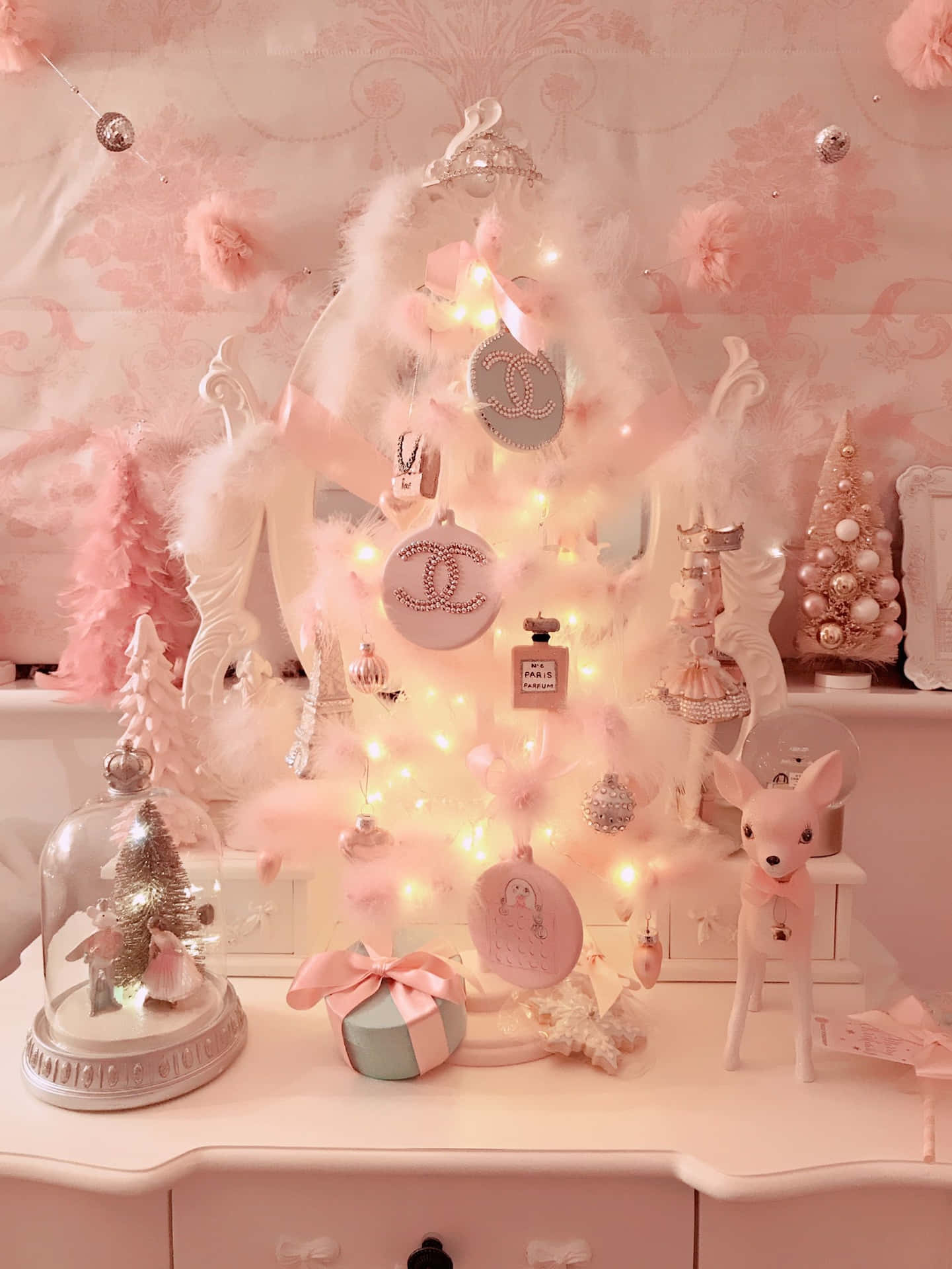 A beautiful pink Christmas Tree brings holiday cheer to any home Wallpaper