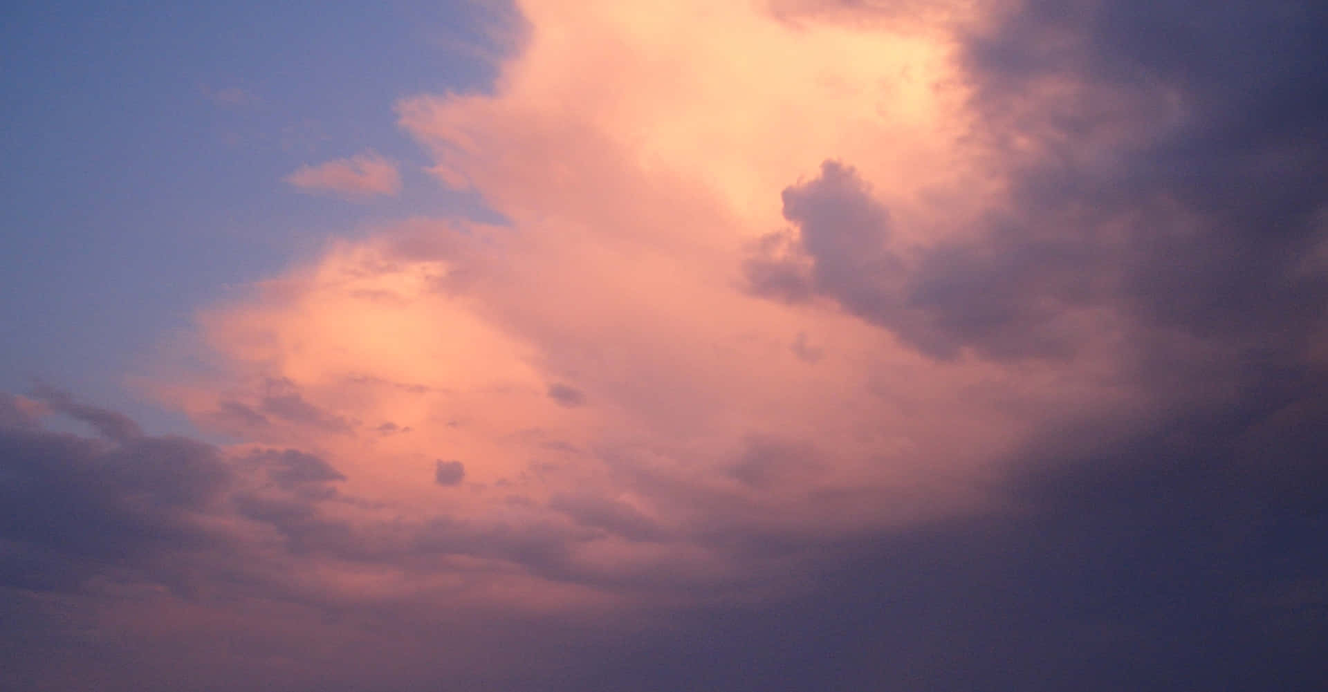 Pink Clouds Background With Dark Edges Background