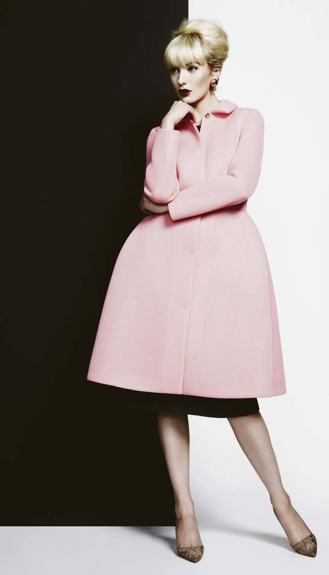 Stylish woman wearing an elegant pink coat Wallpaper