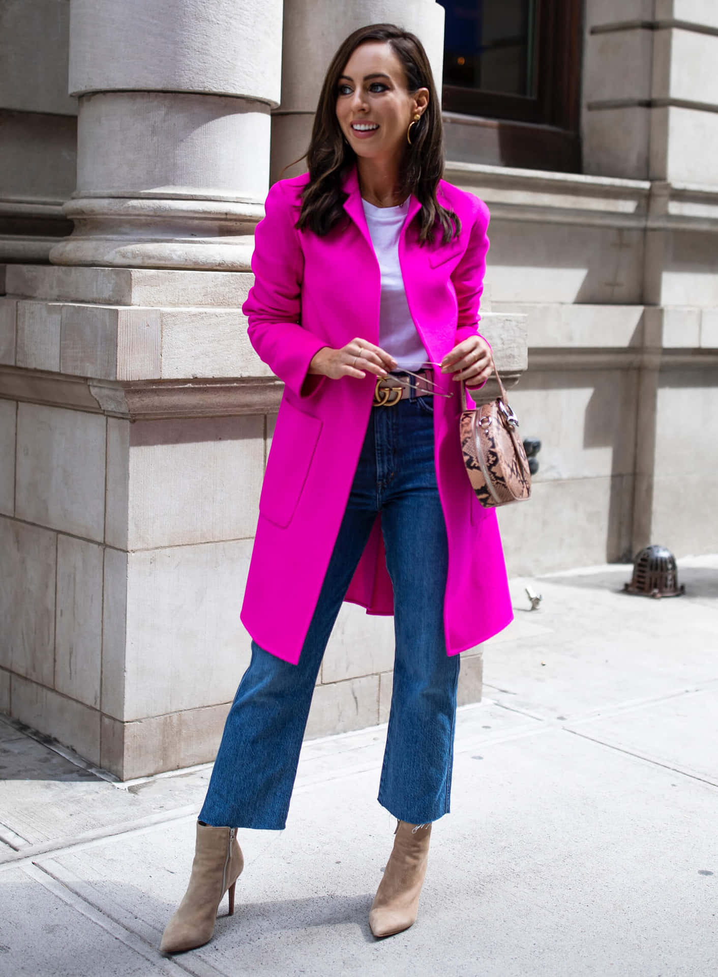 Elegance in Fashion - Woman Wearing a Stylish Pink Coat Wallpaper