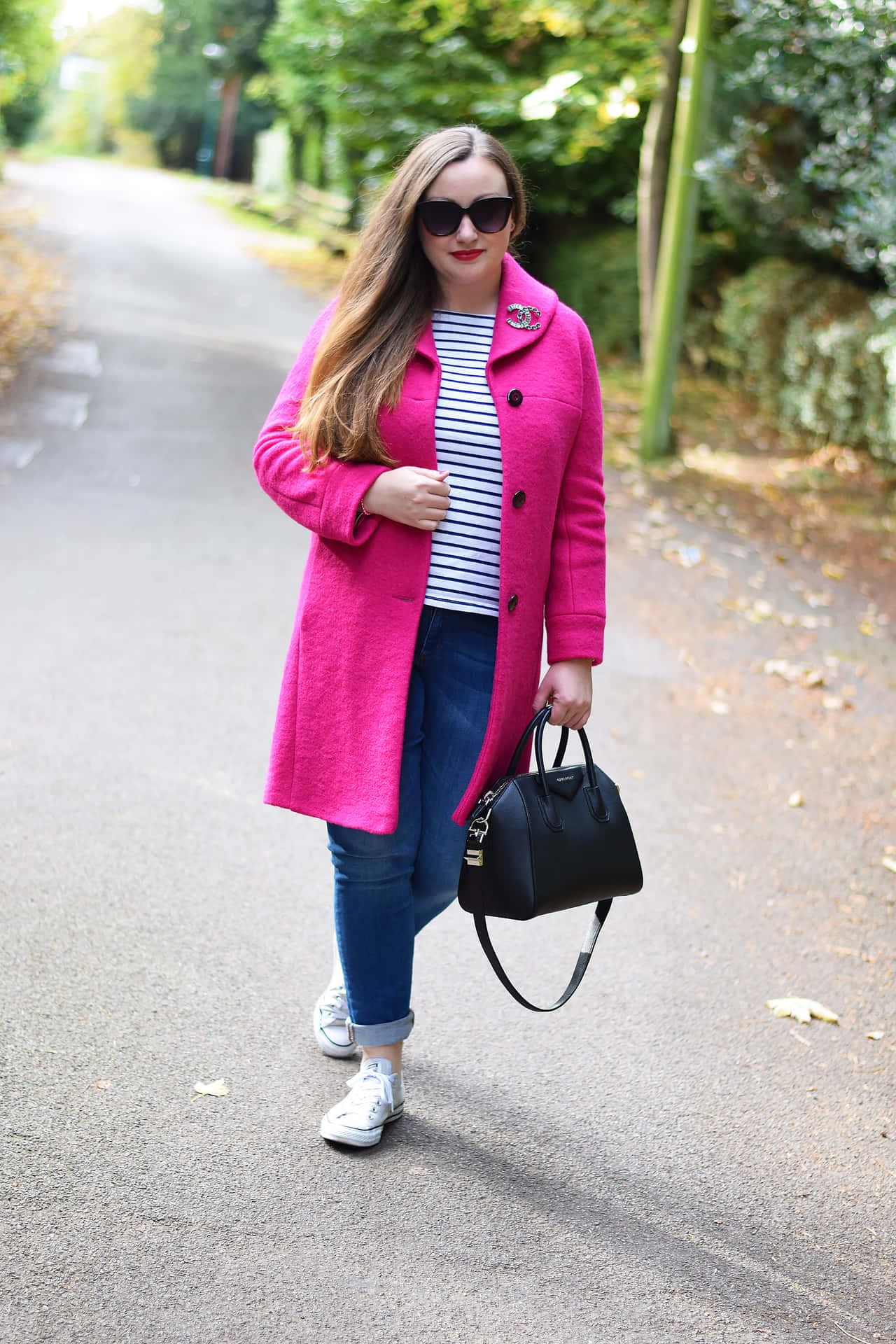 Stylish Woman in Pink Coat Wallpaper