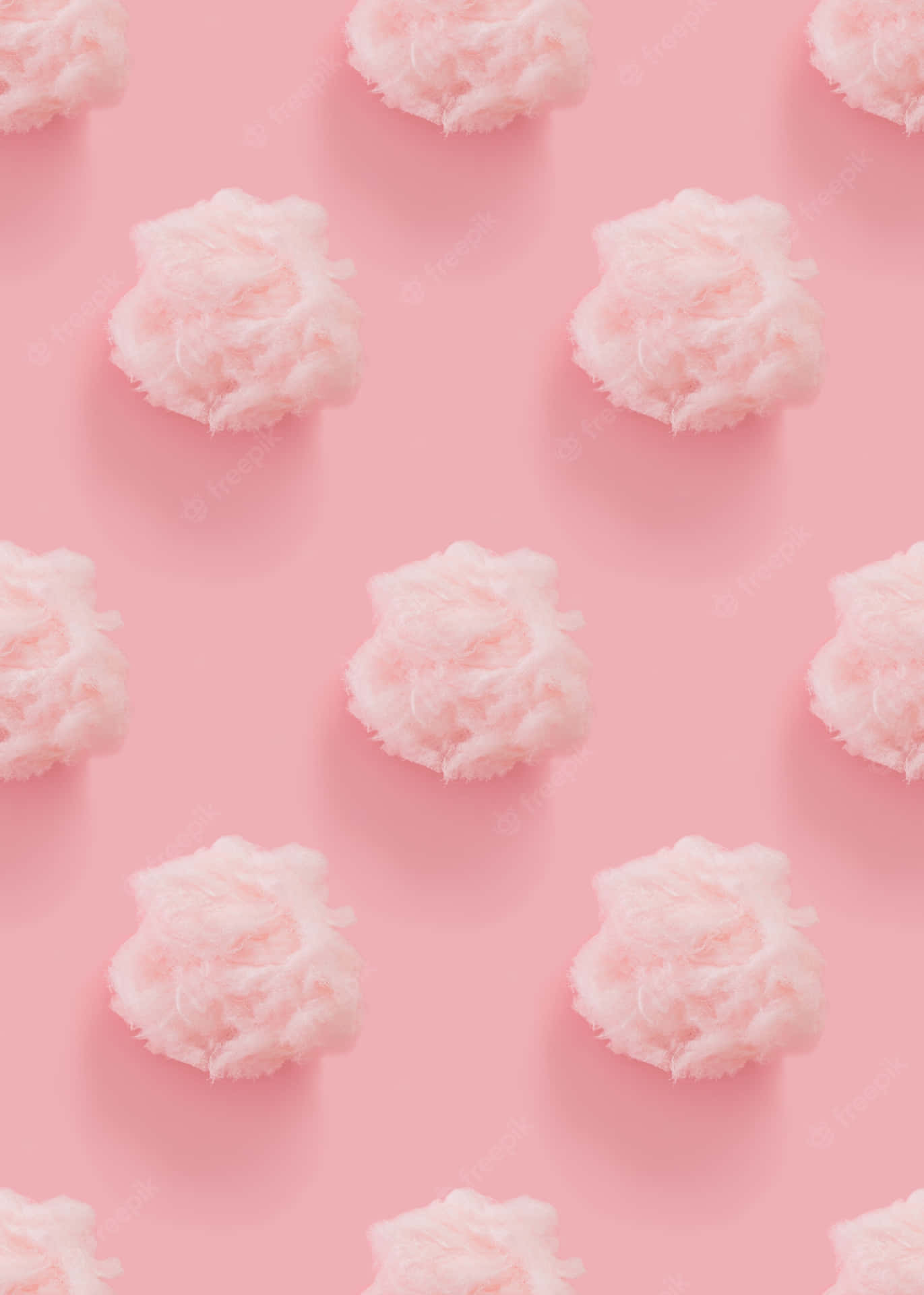 A Pink Background With White Clouds On It Wallpaper