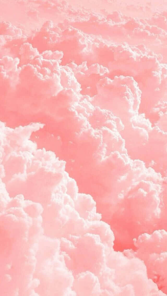 Enjoy the sweet treats of soft and fluffy pink cotton candy Wallpaper